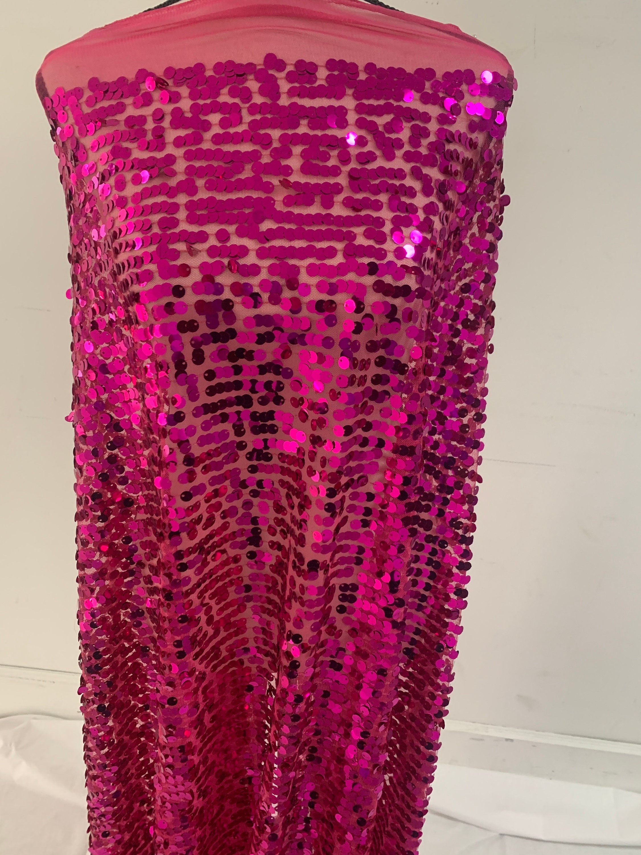 5 yards cut Fucshia sequence fabric.