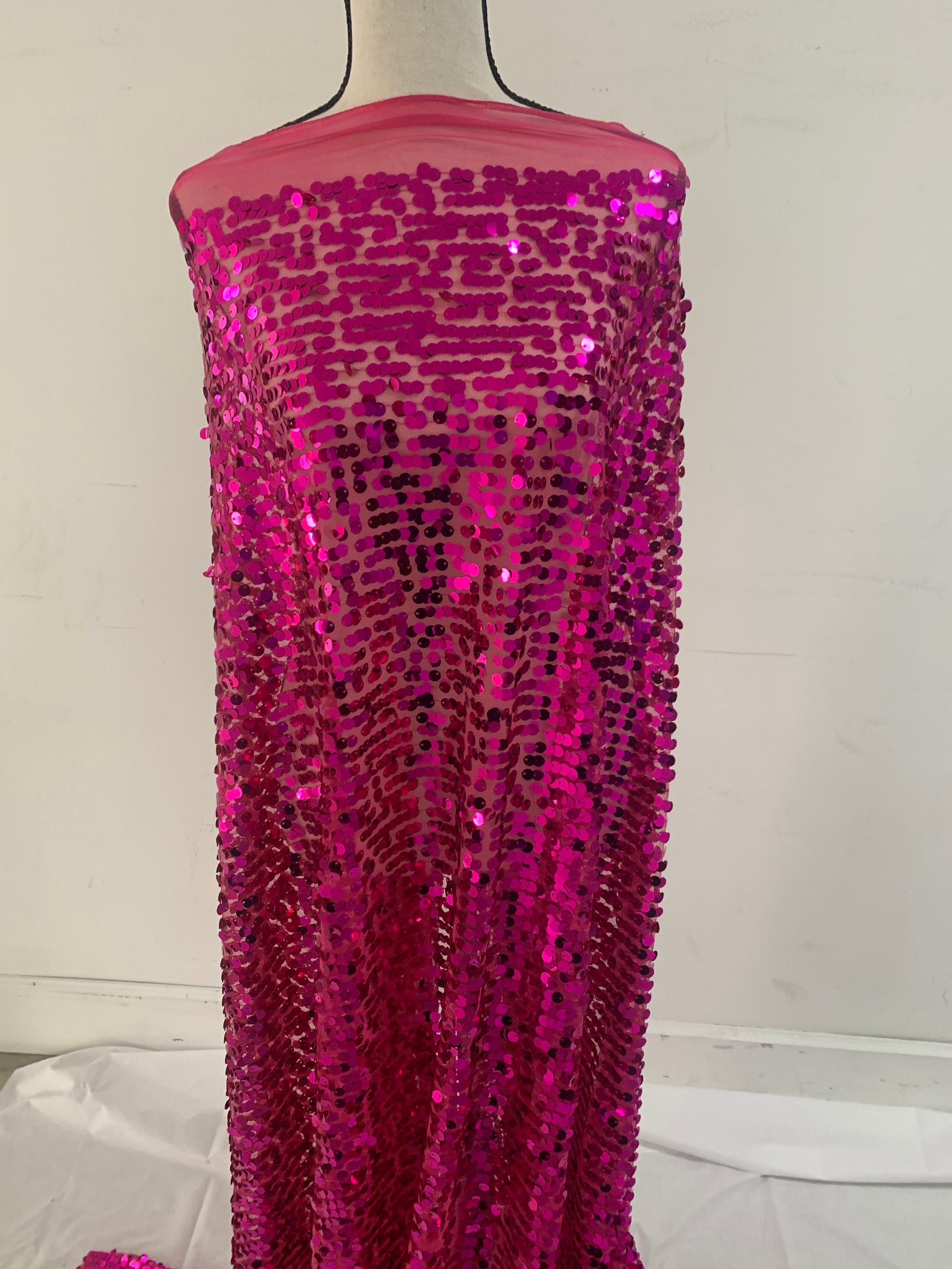 5 yards cut Fucshia sequence fabric.