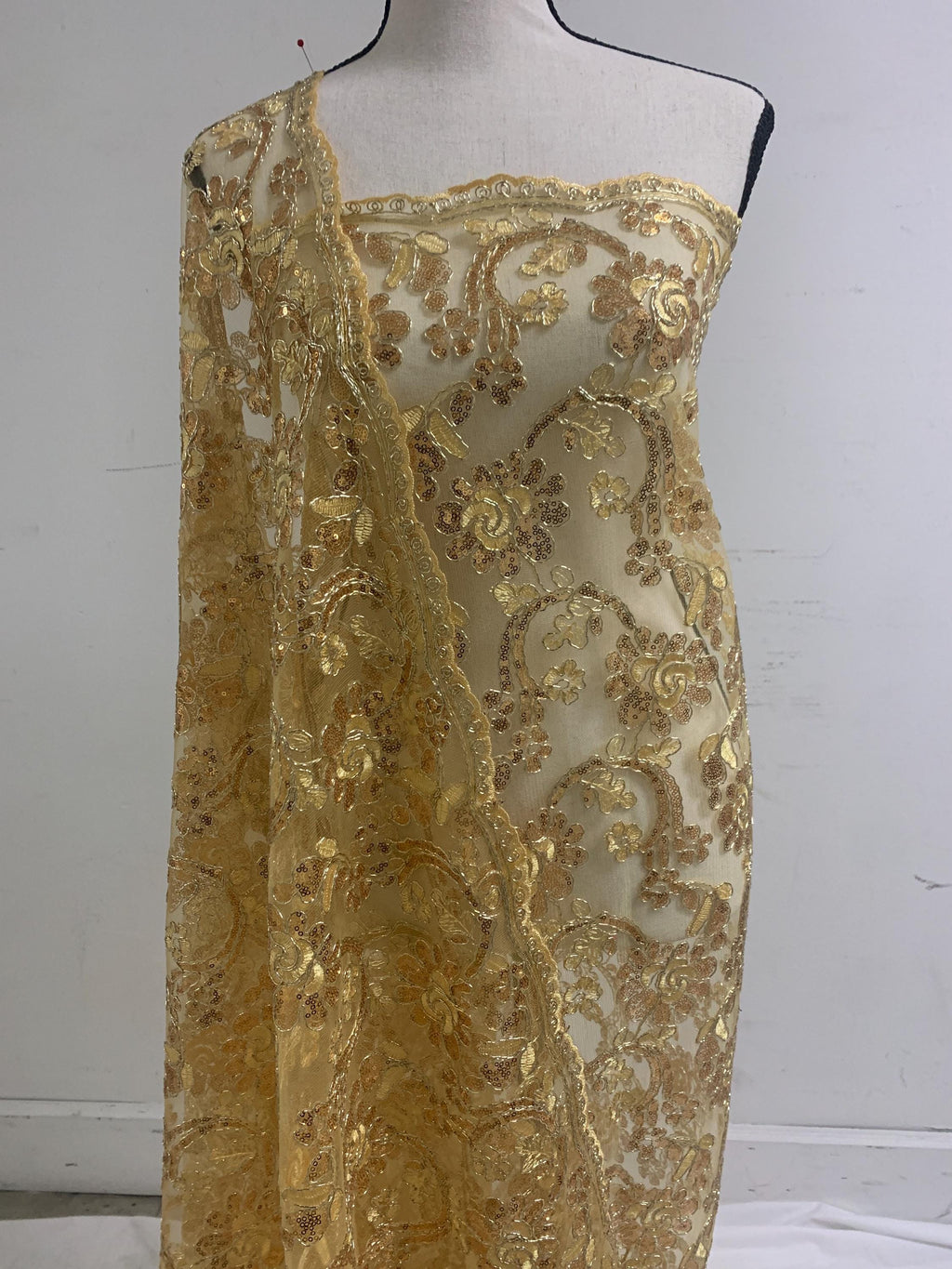 3-yard Gold-colored lace fabric design named Angela, sequins and intricate embroidery with double scalloped edges. Width 49/50"