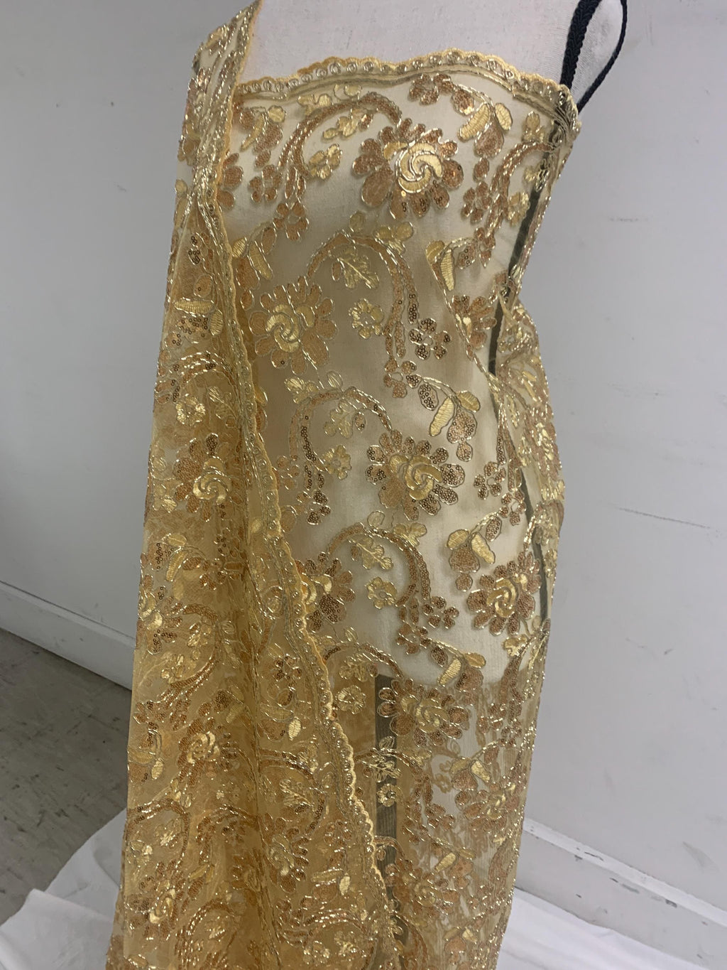 3-yard Gold-colored lace fabric design named Angela, sequins and intricate embroidery with double scalloped edges. Width 49/50"