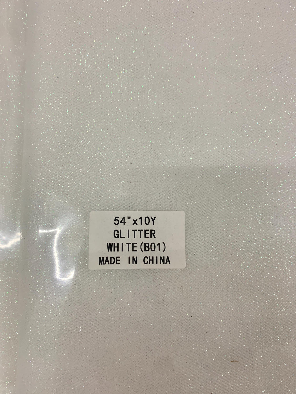 White Gliter Tulle 54" double fold white with unicorn gliter 10 yards per pack.