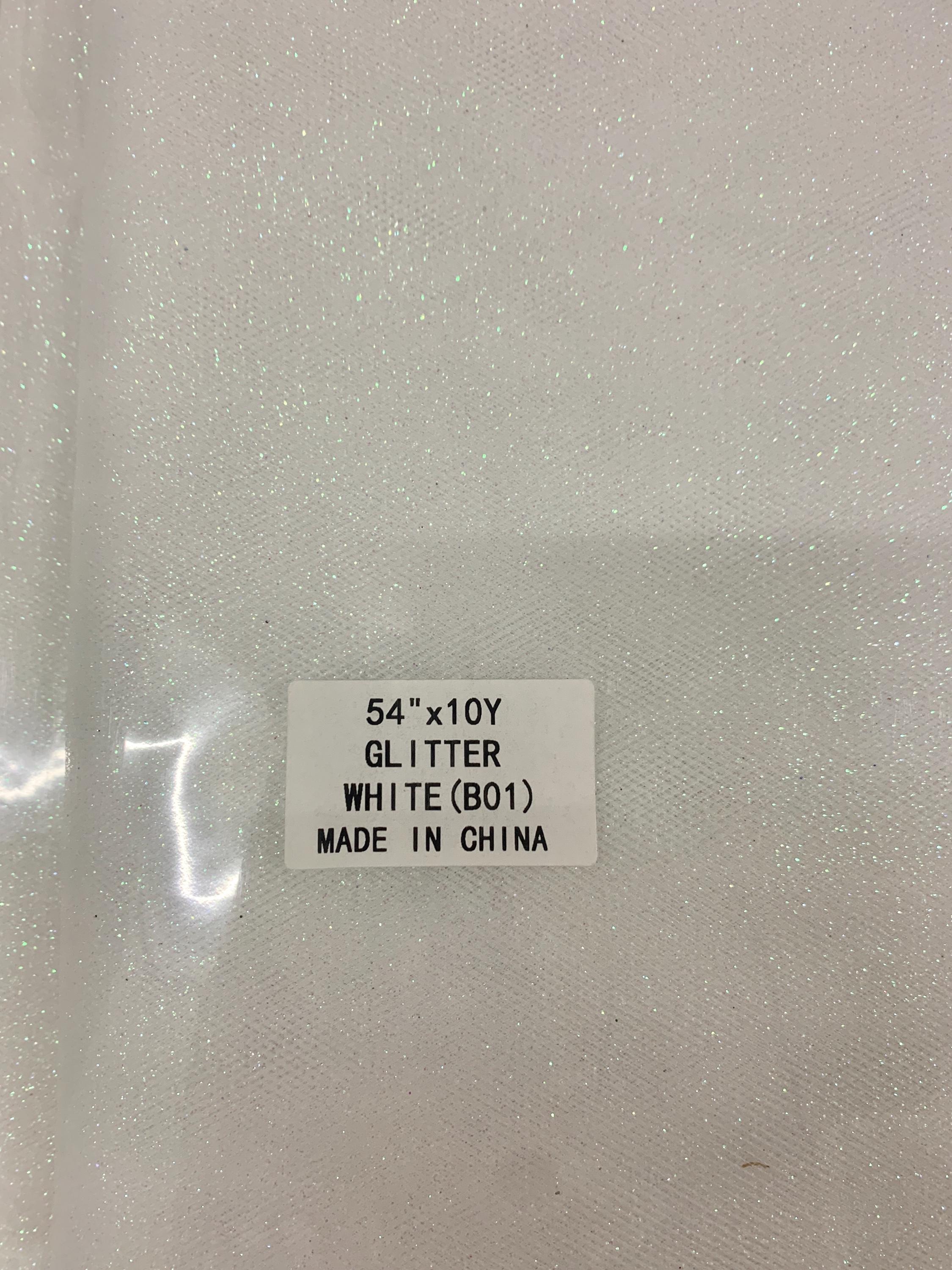 White Gliter Tulle 54" double fold white with unicorn gliter 10 yards per pack.