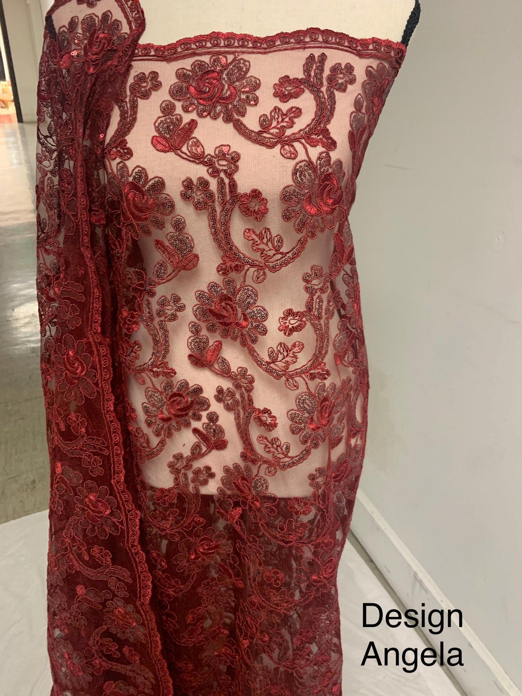 3-yard Burgundy-colored lace fabric design named Angela, sequins and intricate embroidery with double scalloped edges. Width 49/50"