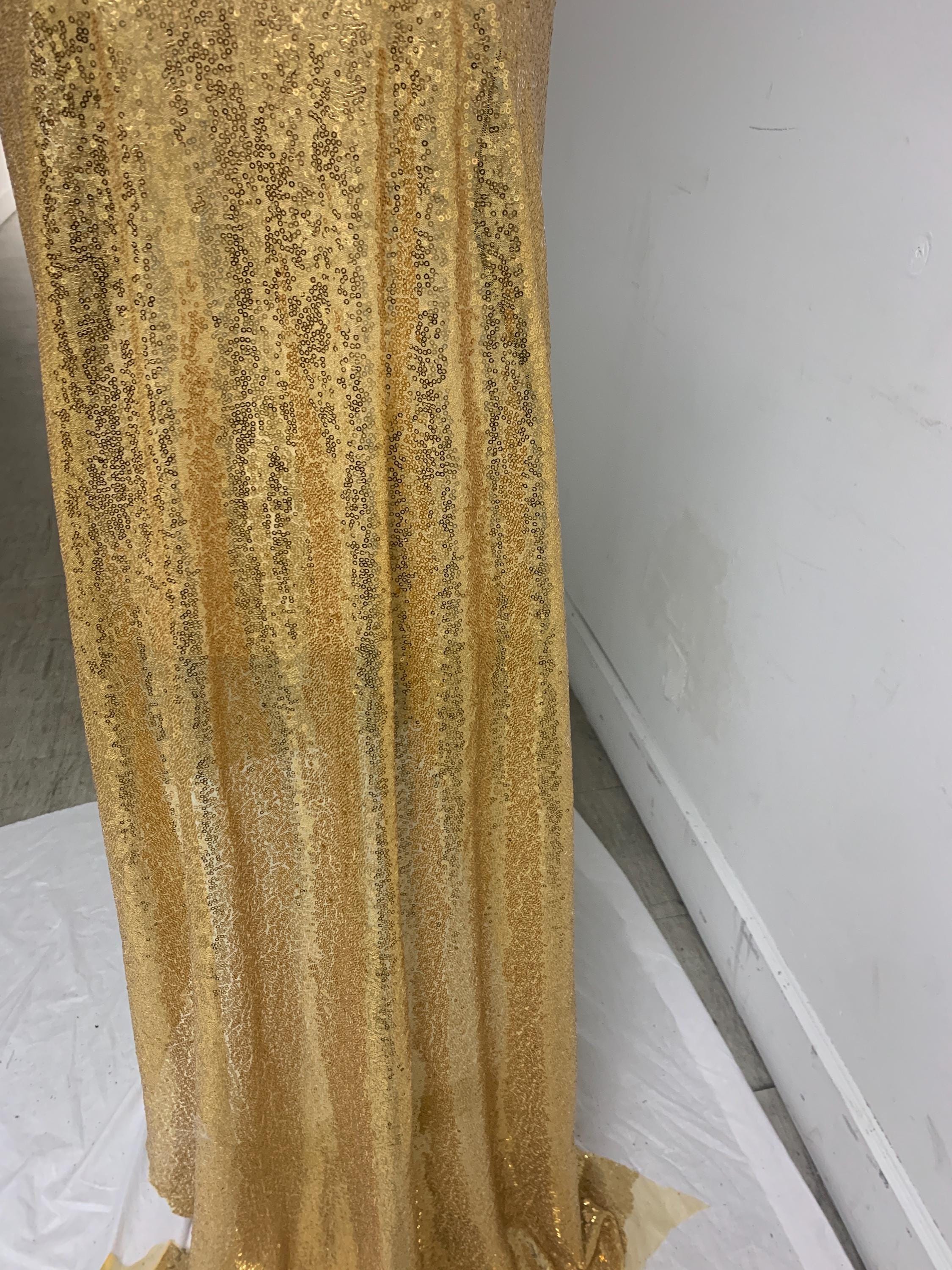Gold color sequins mesh fabric. common use in craft, jacket, costume, dull, table runner, color gold.