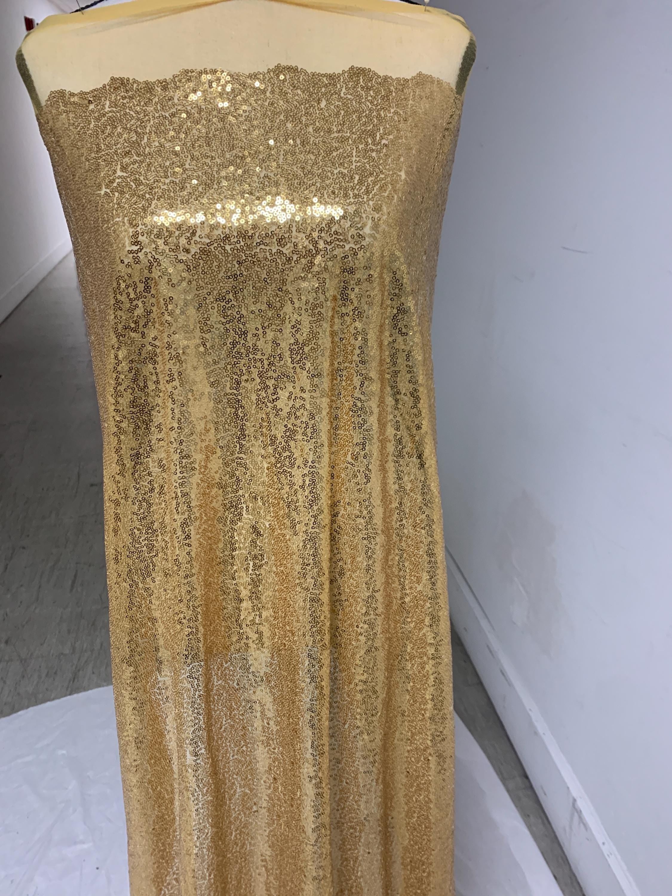 Gold color sequins mesh fabric. common use in craft, jacket, costume, dull, table runner, color gold.