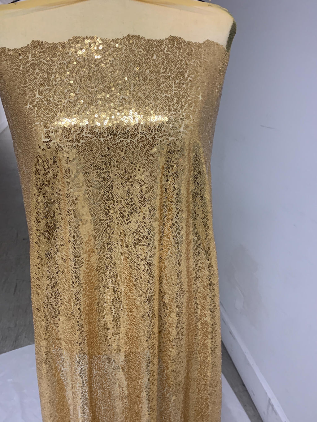 Gold color sequins mesh fabric. common use in craft, jacket, costume, dull, table runner, color gold.