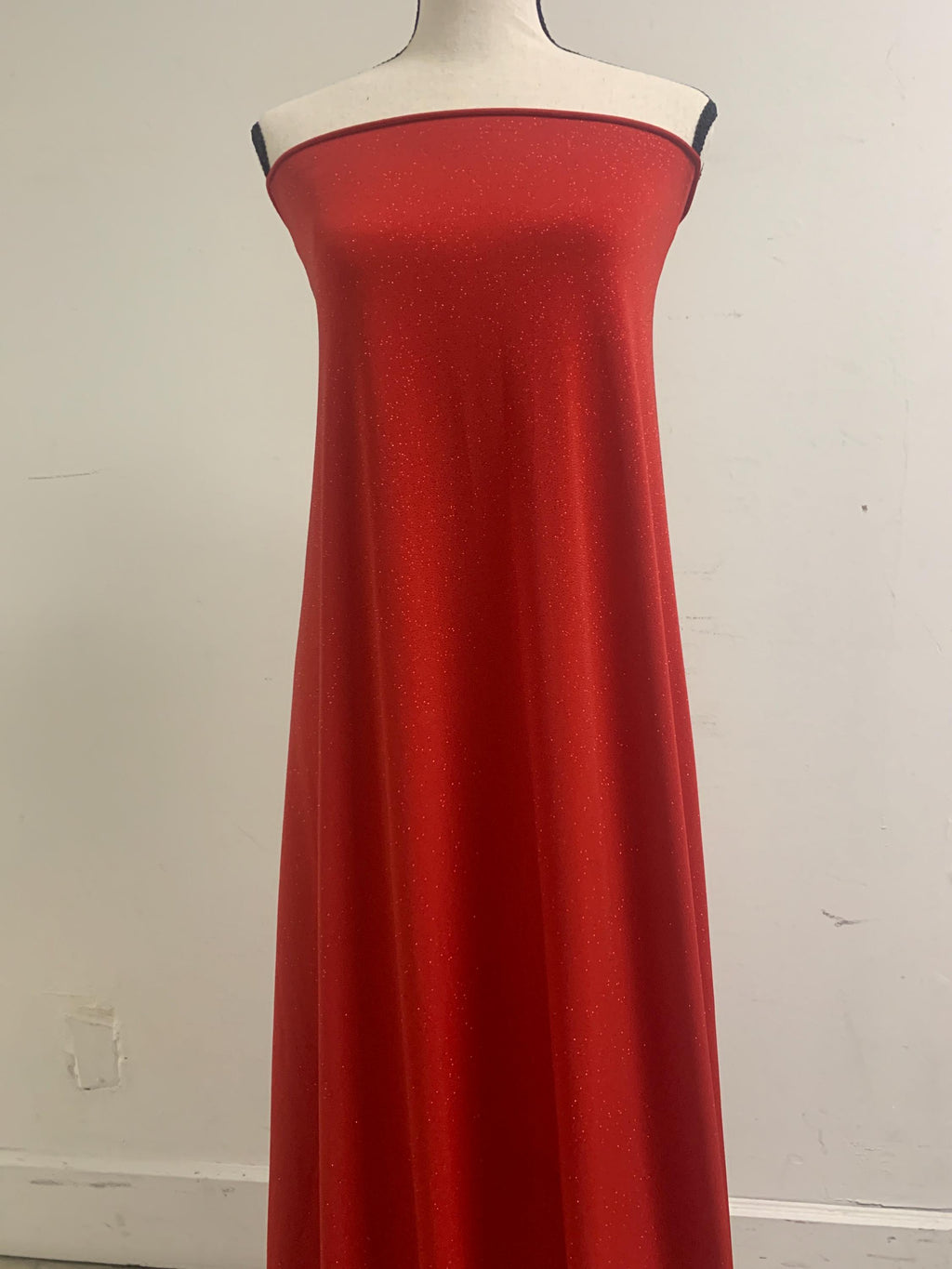 Red Gliter stretch Fabric width 58/60" , know as ity sells by 1 yard continues increment. polyester spandex.