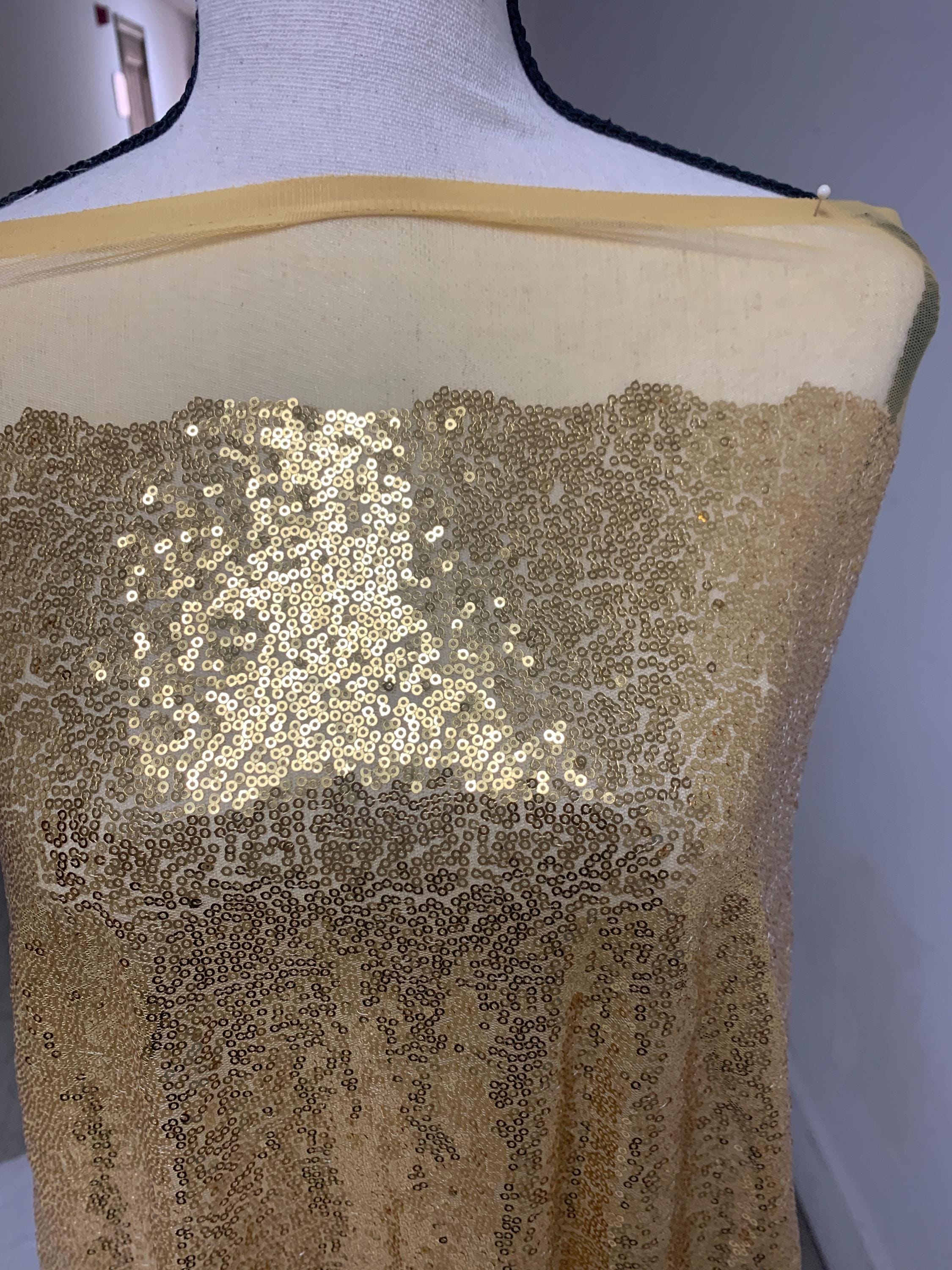 Gold color sequins mesh fabric. common use in craft, jacket, costume, dull, table runner, color gold.