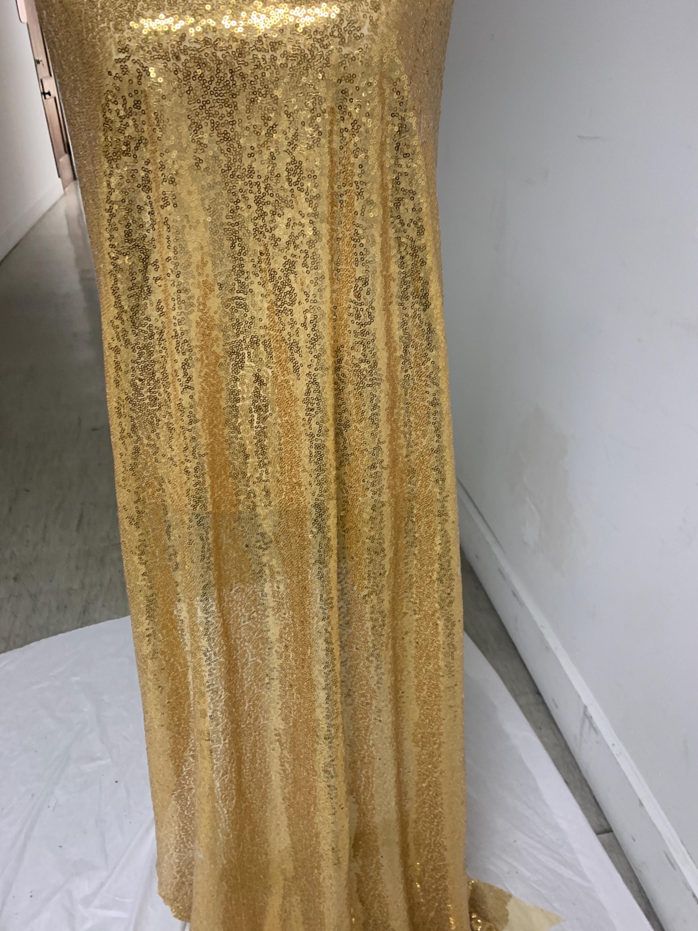 Gold color sequins mesh fabric. common use in craft, jacket, costume, dull, table runner, color gold.