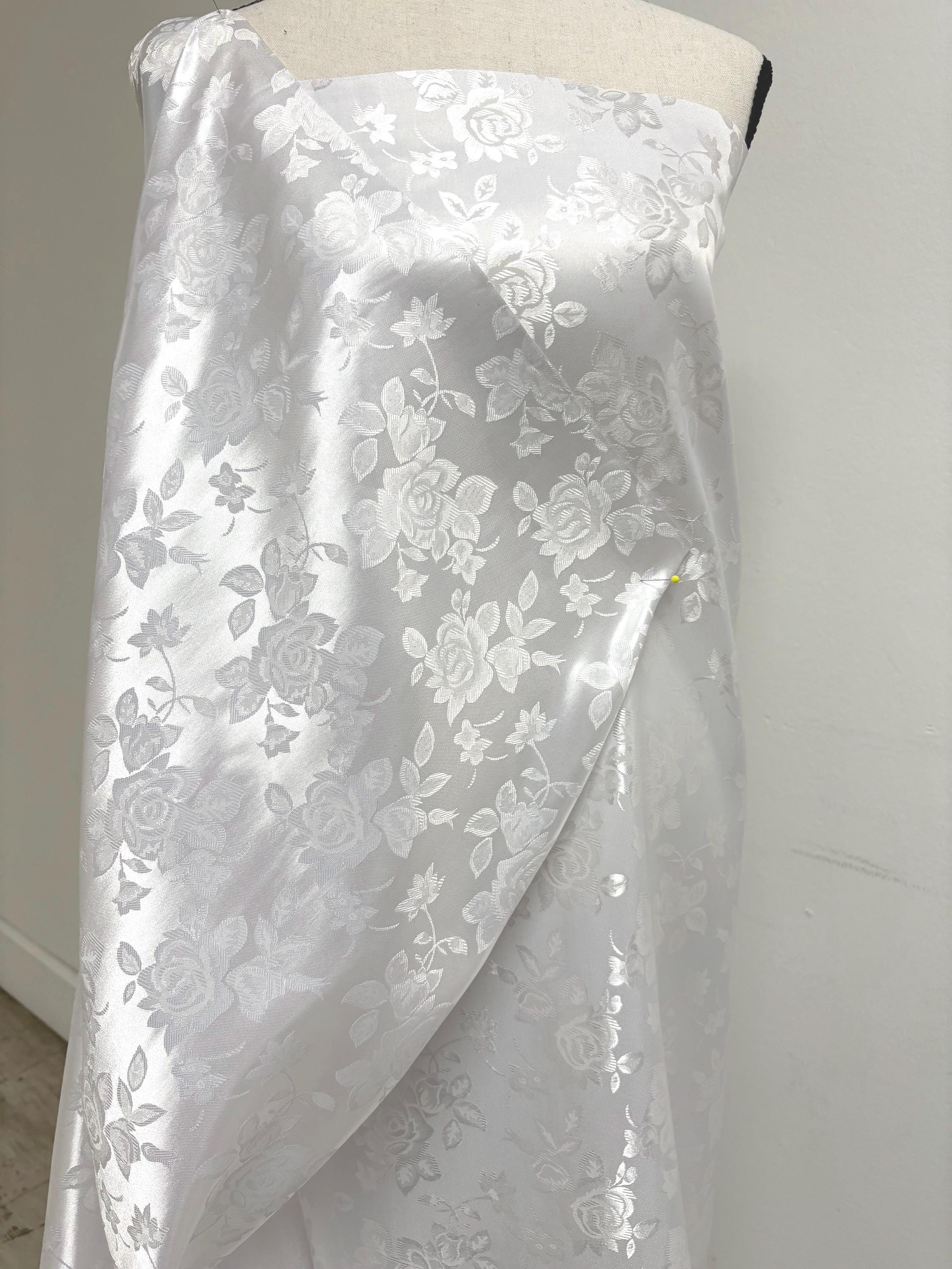 A 2 yards White Satin Jacquard fabric. width 58 inches, polyester sell by 2 yards continuous.