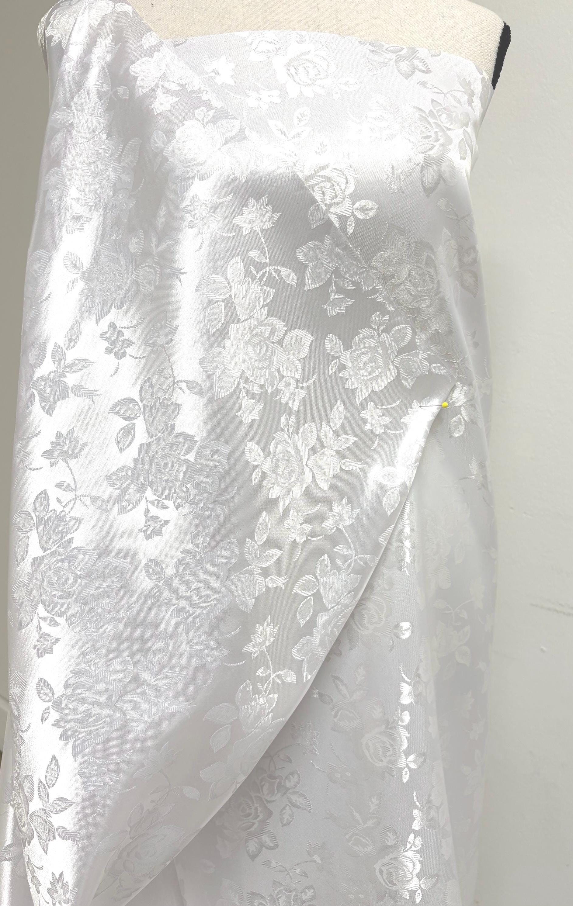 A 2 yards White Satin Jacquard fabric. width 58 inches, polyester sell by 2 yards continuous.
