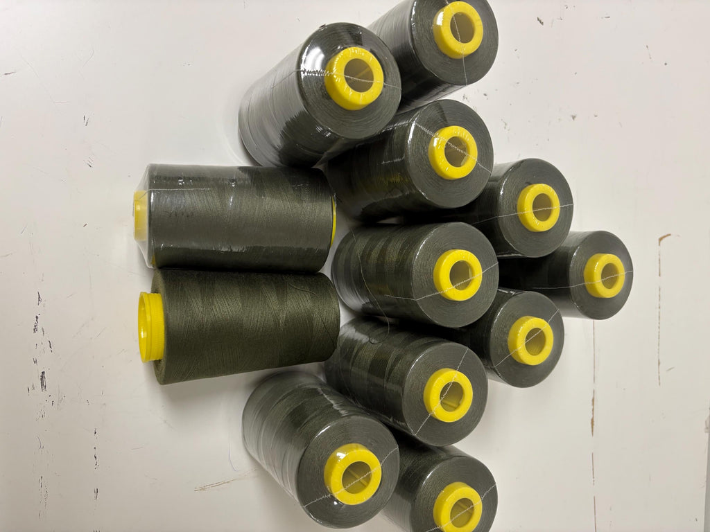 Olive sewing threads, polyester 130 gram per cone, 5000 yards per cone, wrap in clear cover for daily sewing. size 24T. made in usa. PT 945