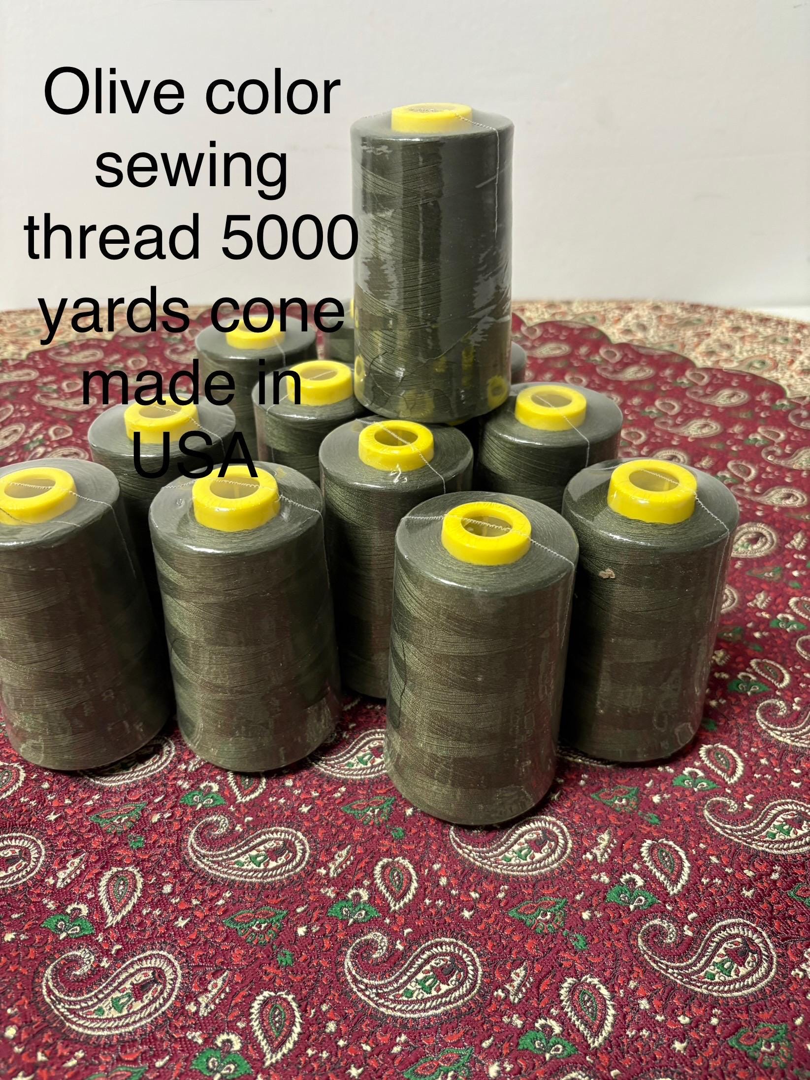 Olive sewing threads, polyester 130 gram per cone, 5000 yards per cone, wrap in clear cover for daily sewing. size 24T. made in usa. PT 945