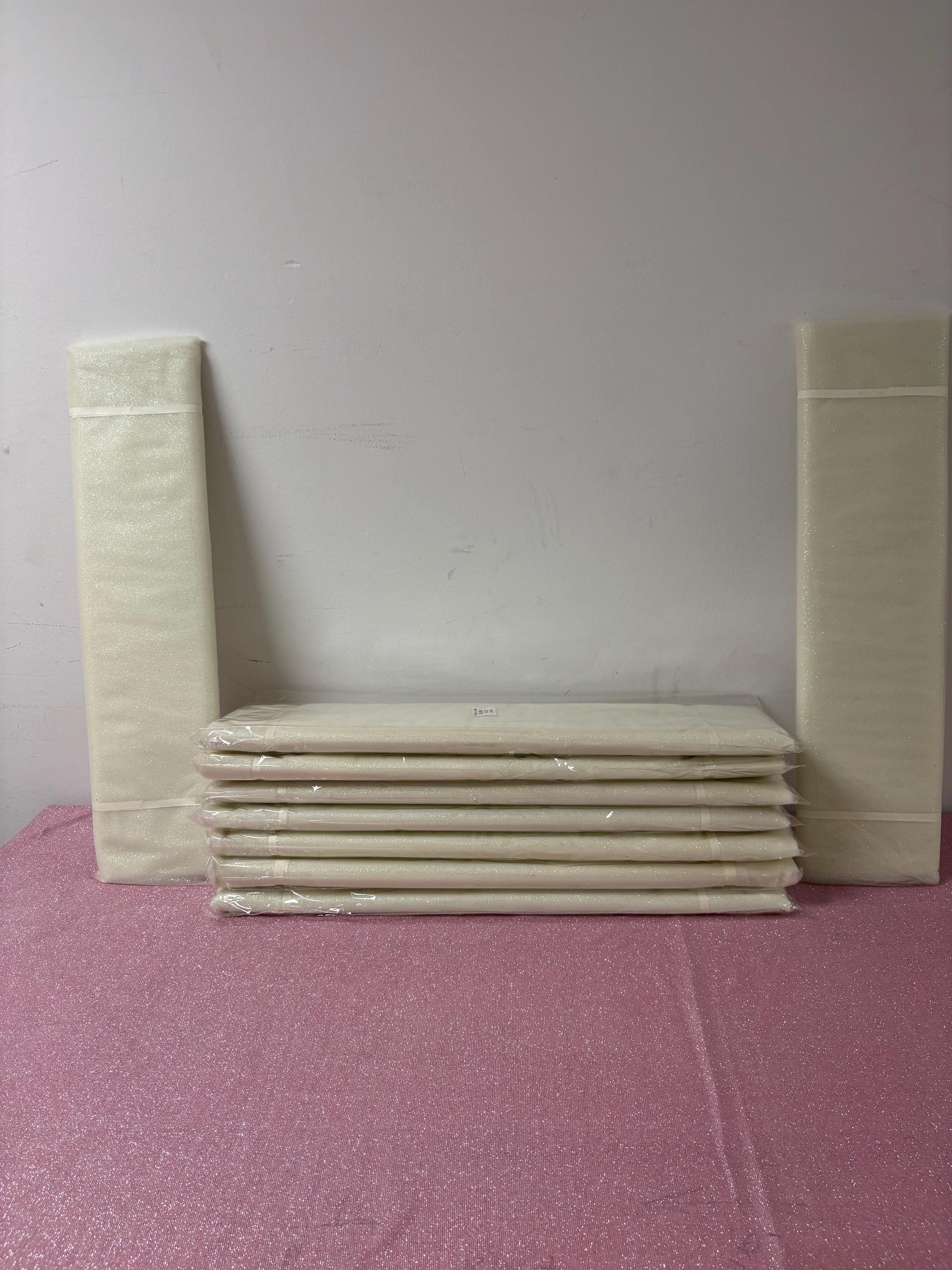 Ivory Tulle Gliter 54" double fold, color Ivory with unicorn glitter 10 yards per pack.