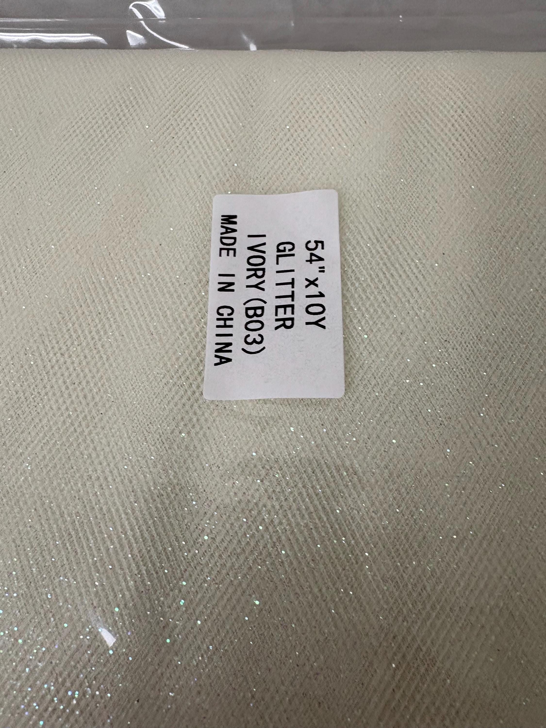 Ivory Tulle Gliter 54" double fold, color Ivory with unicorn glitter 10 yards per pack.