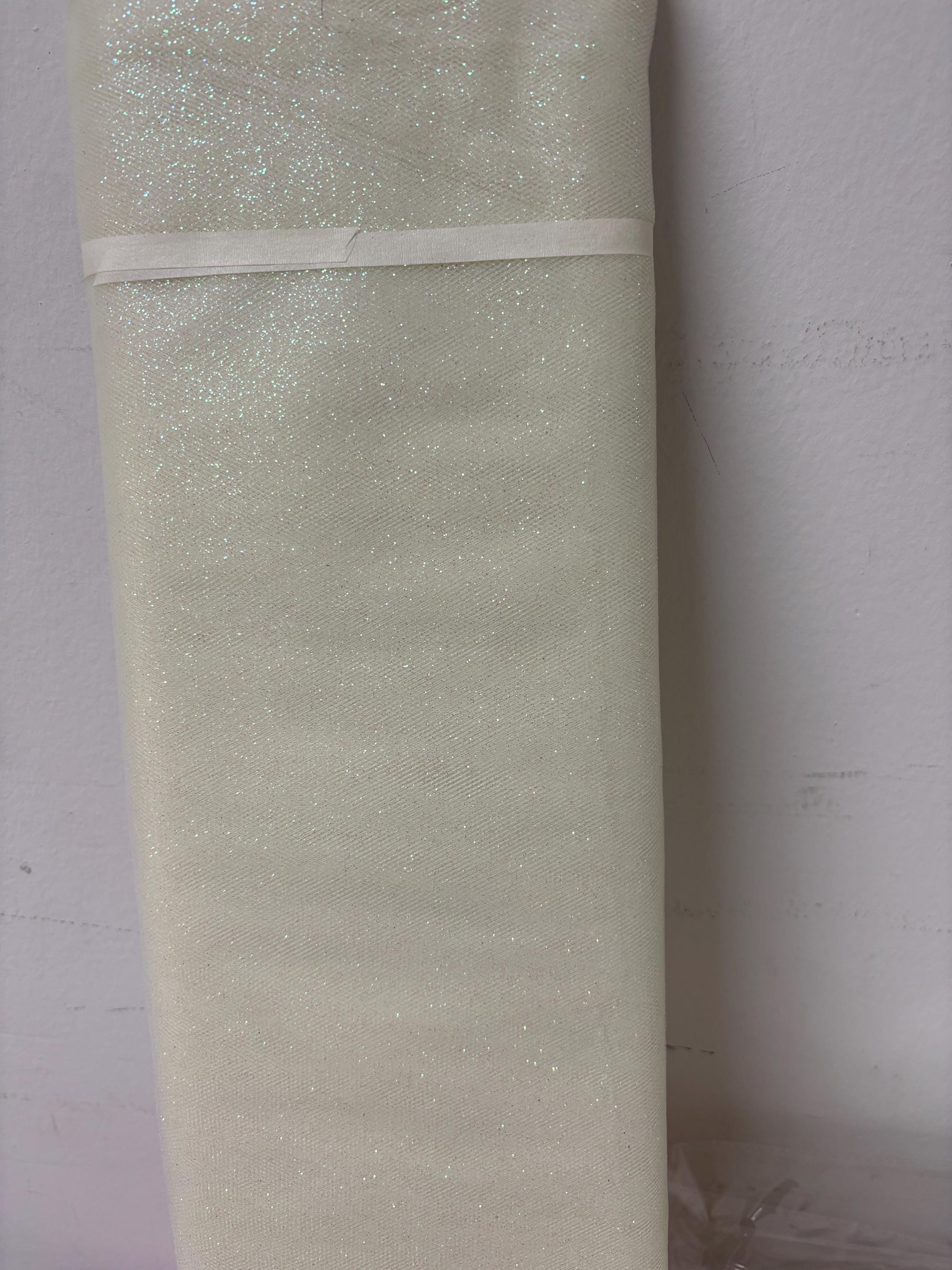 Ivory Tulle Gliter 54" double fold, color Ivory with unicorn glitter 10 yards per pack.