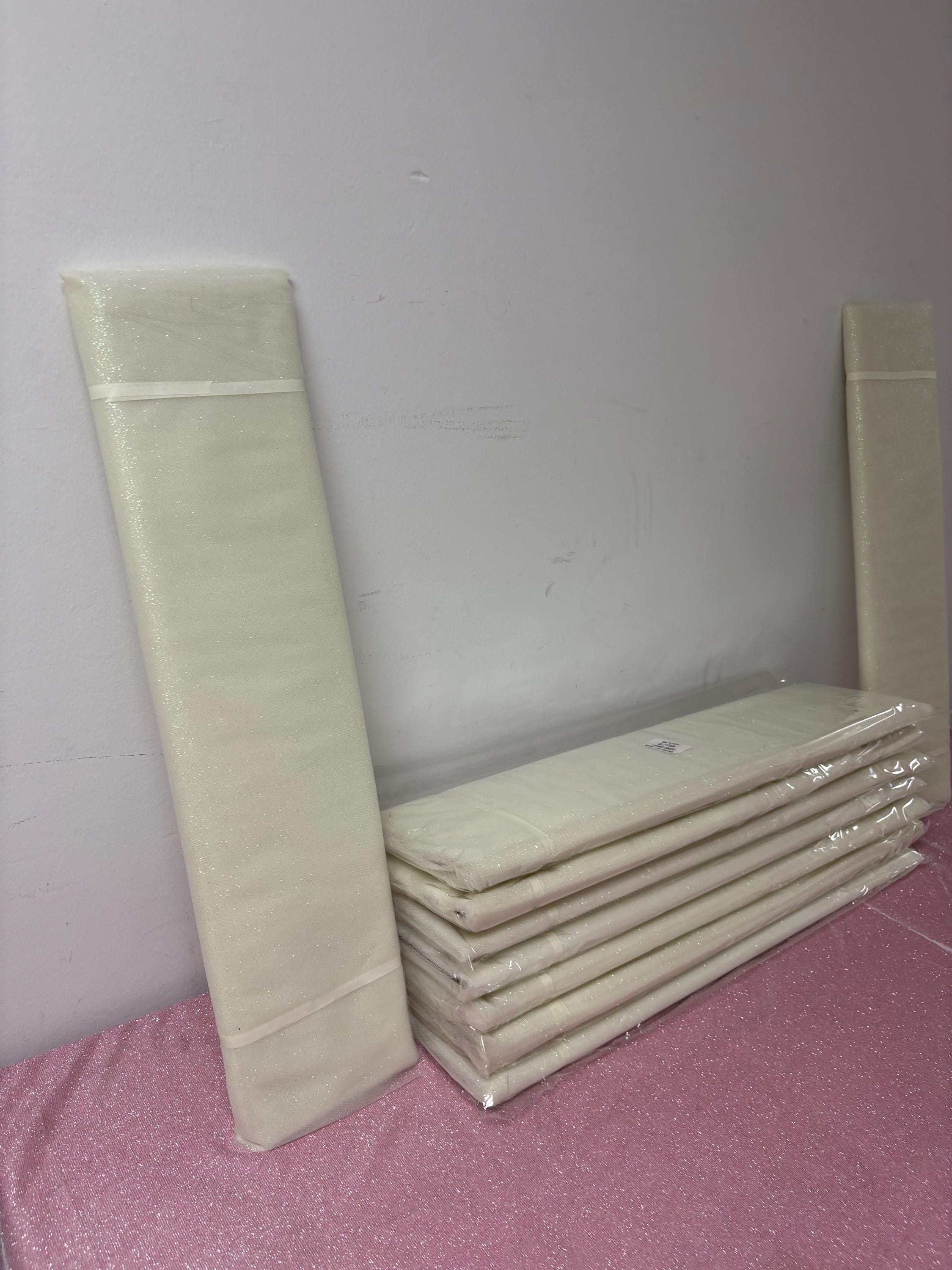 Ivory Tulle Gliter 54" double fold, color Ivory with unicorn glitter 10 yards per pack.