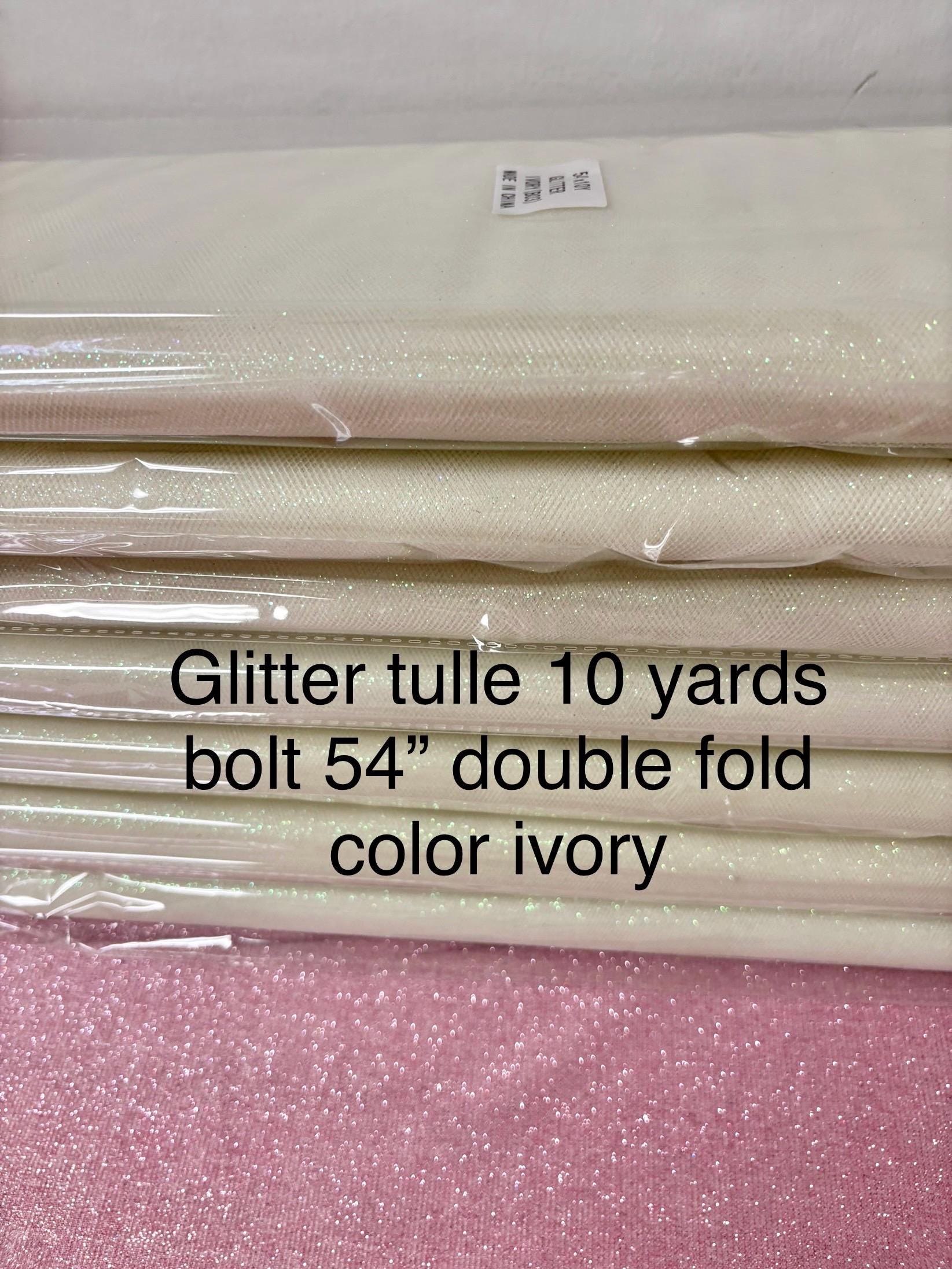 Ivory Tulle Gliter 54" double fold, color Ivory with unicorn glitter 10 yards per pack.