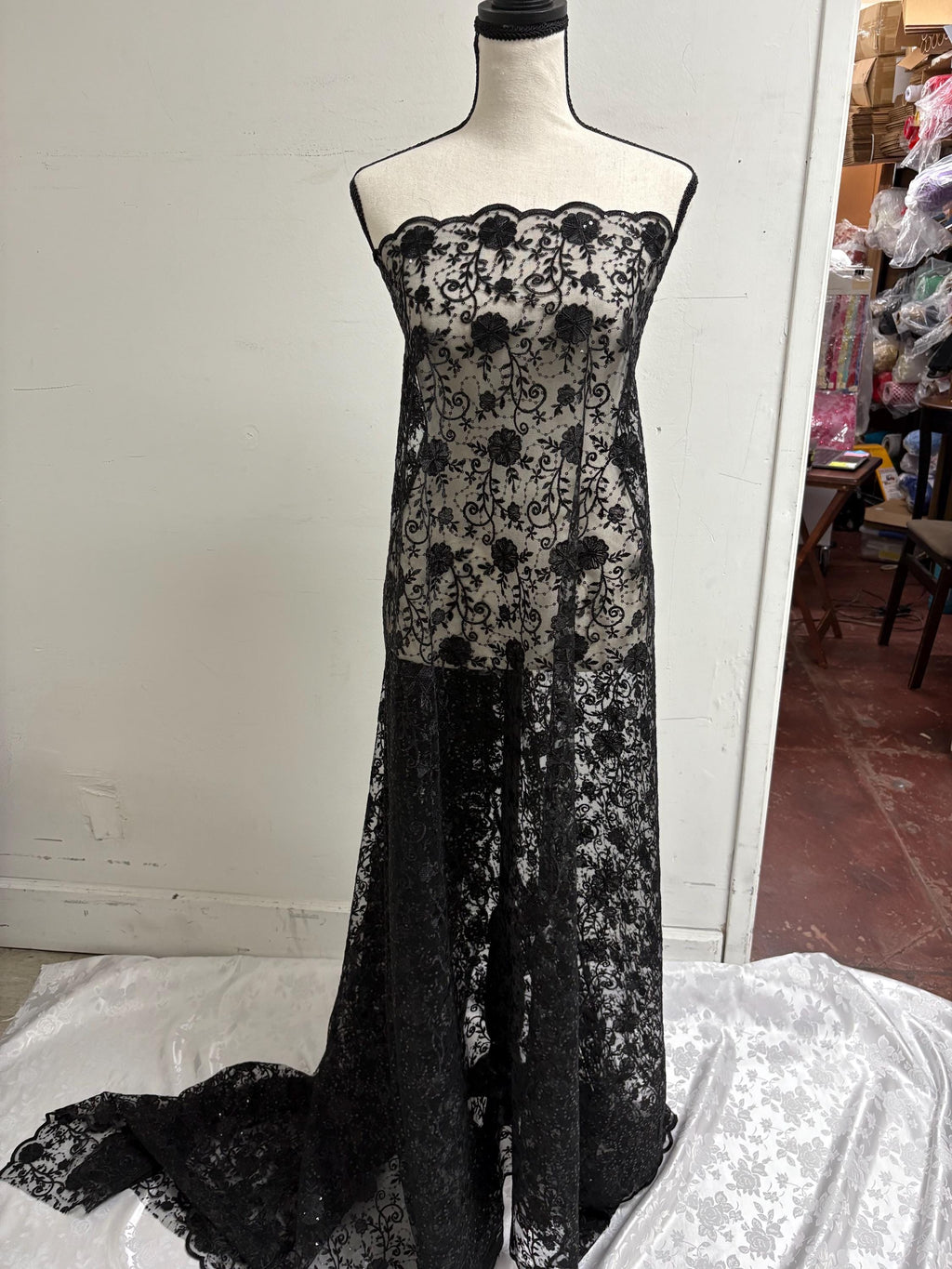 A 3-yard cut of Black Lace fabric with a width of 49/50 inches, featuring double scalloped embroidery and sequins. Design code: 04331279.