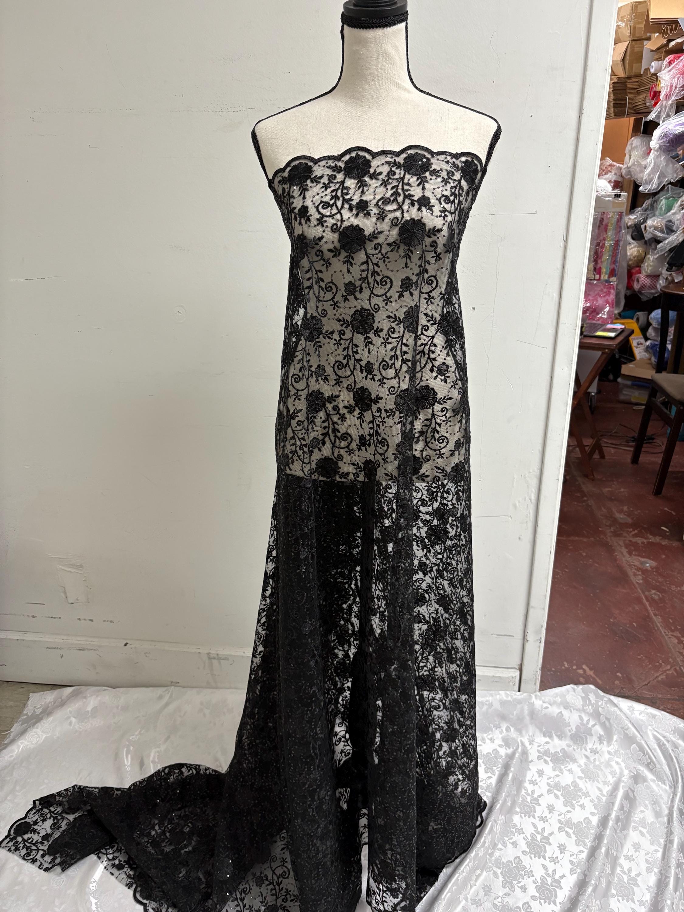 A 3-yard cut of Black Lace fabric with a width of 49/50 inches, featuring double scalloped embroidery and sequins. Design code: 04331279.