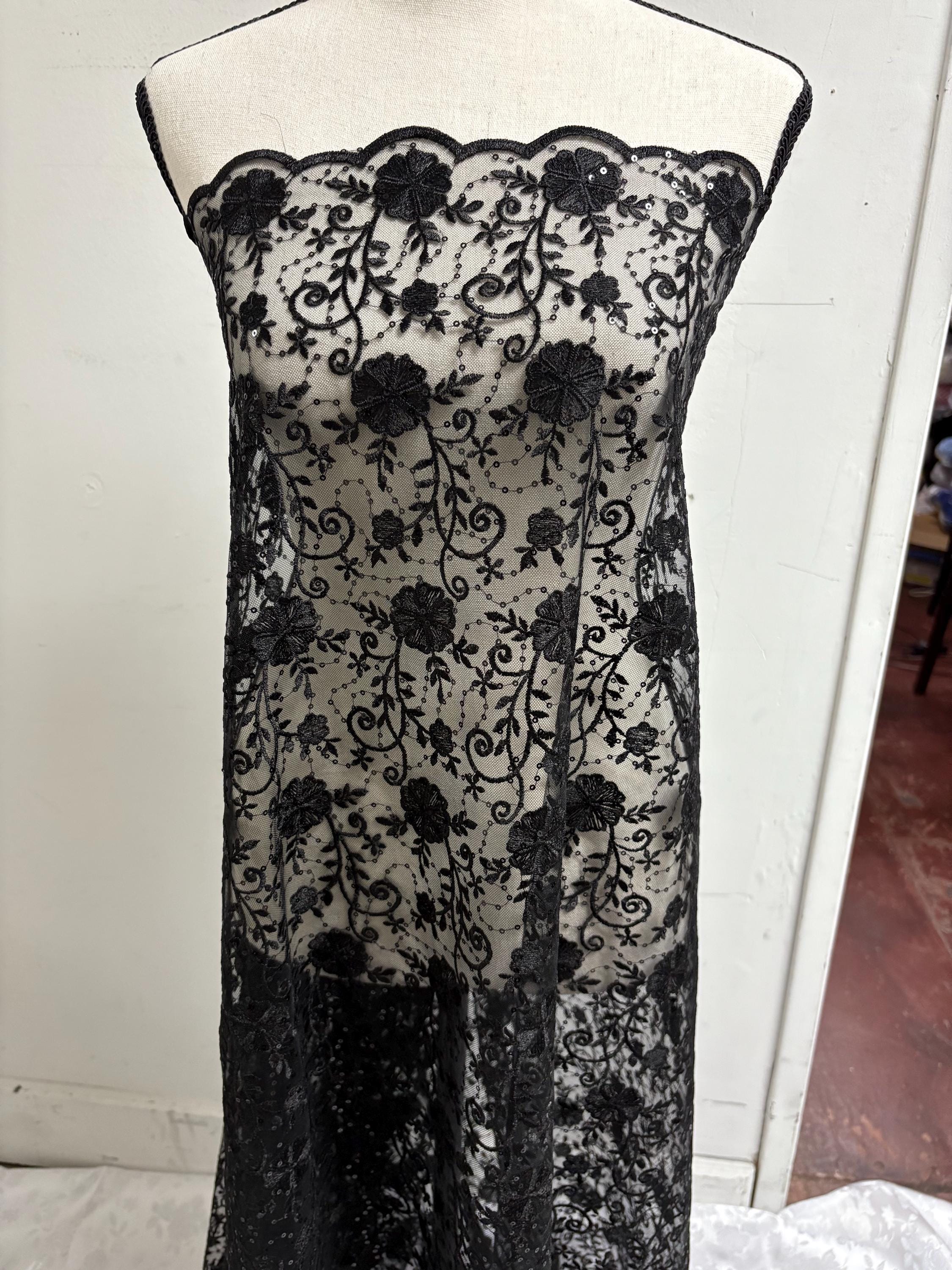 A 3-yard cut of Black Lace fabric with a width of 49/50 inches, featuring double scalloped embroidery and sequins. Design code: 04331279.