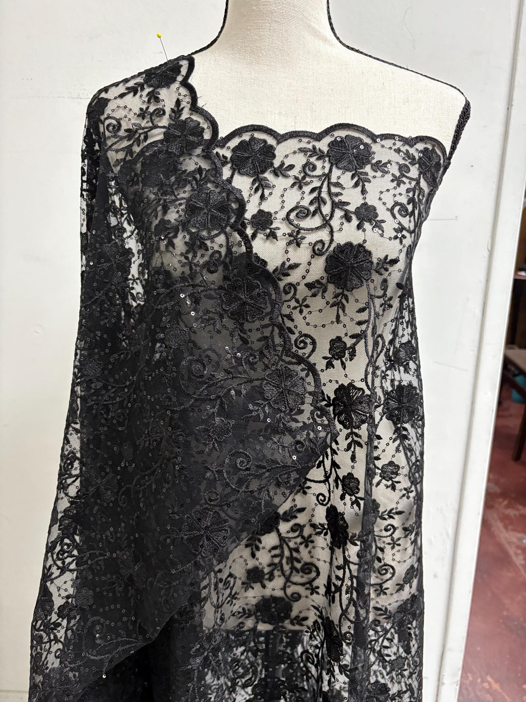 A 3-yard cut of Black Lace fabric with a width of 49/50 inches, featuring double scalloped embroidery and sequins. Design code: 04331279.