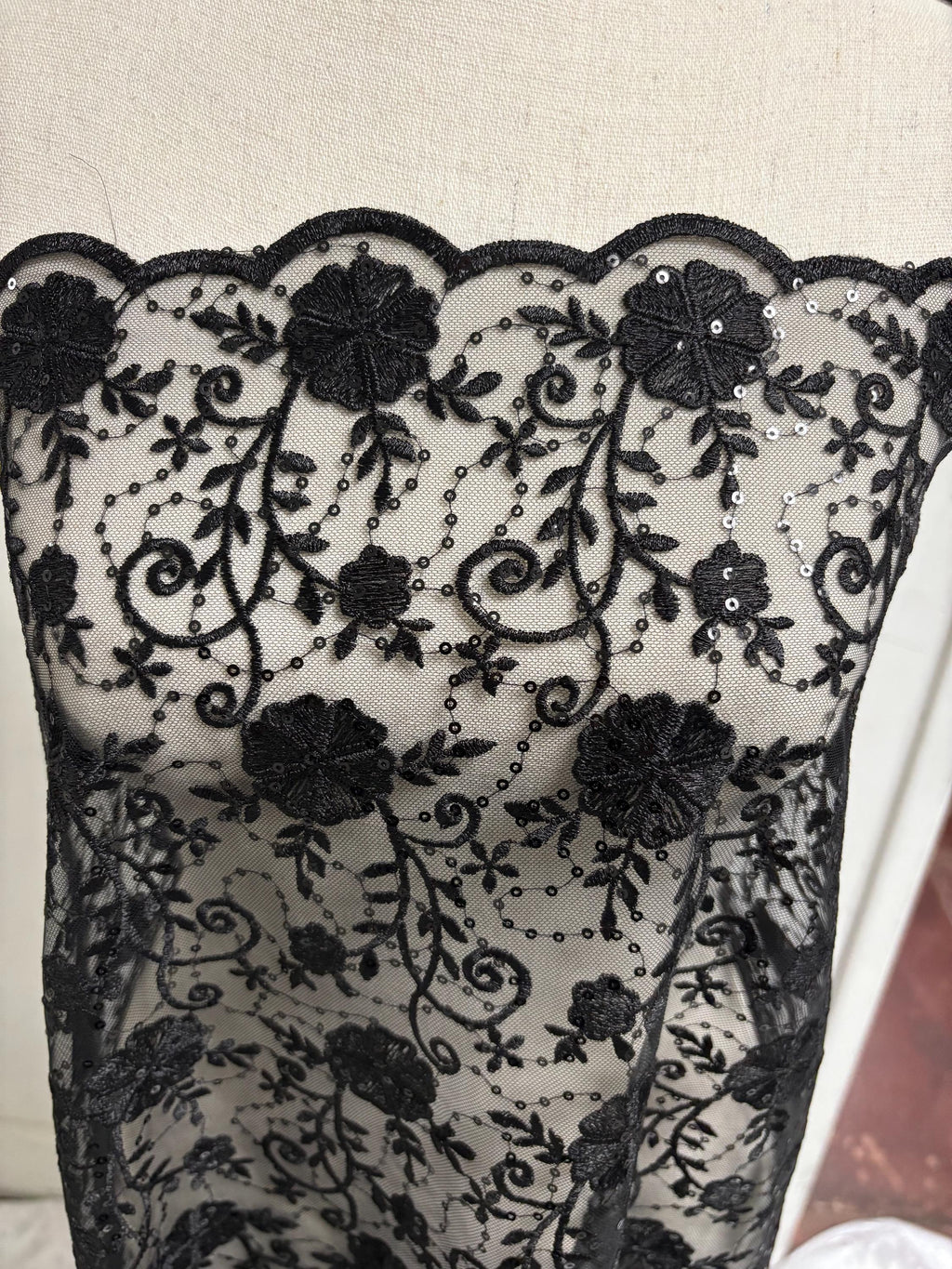 A 3-yard cut of Black Lace fabric with a width of 49/50 inches, featuring double scalloped embroidery and sequins. Design code: 04331279.