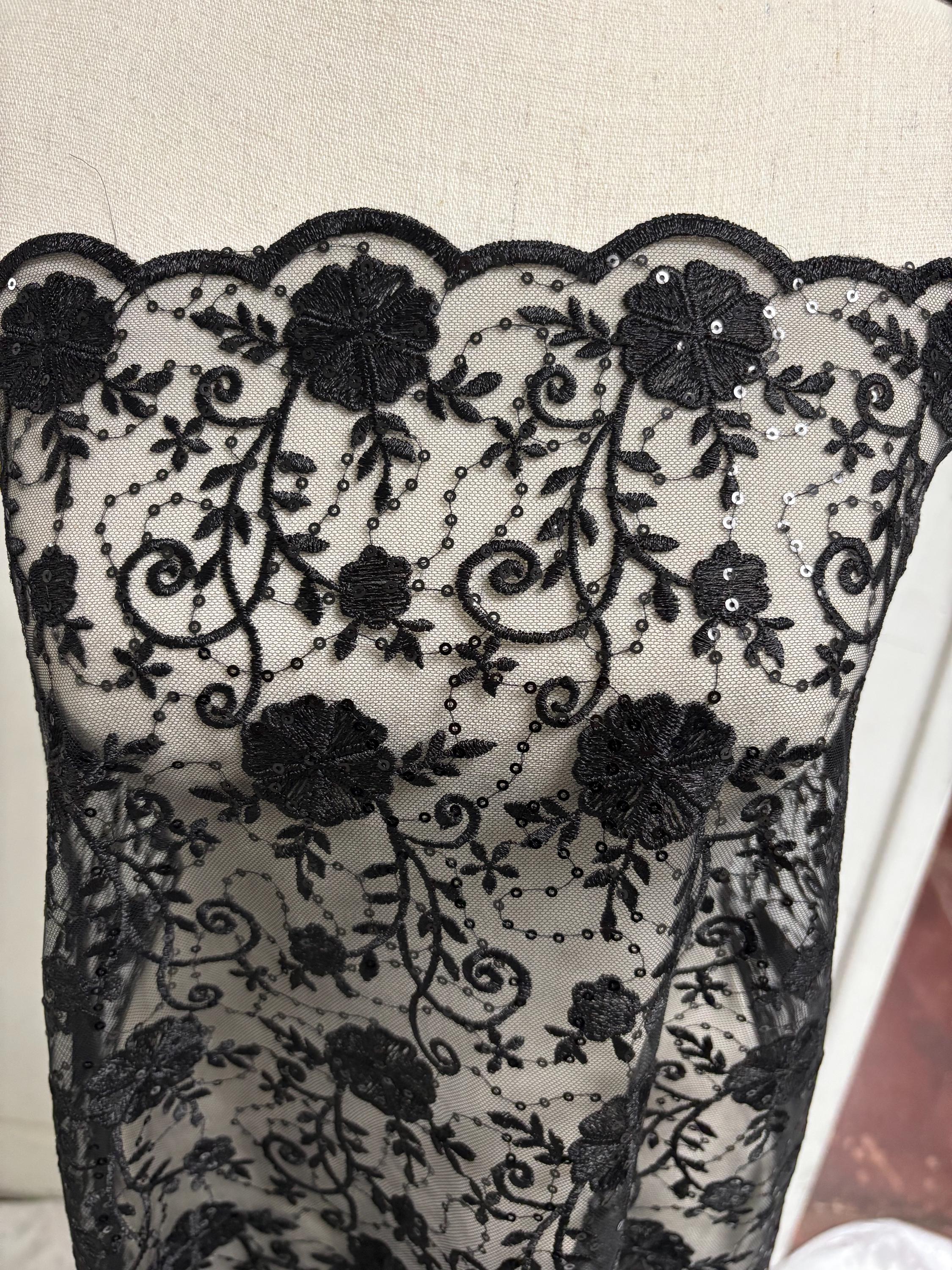 A 3-yard cut of Black Lace fabric with a width of 49/50 inches, featuring double scalloped embroidery and sequins. Design code: 04331279.
