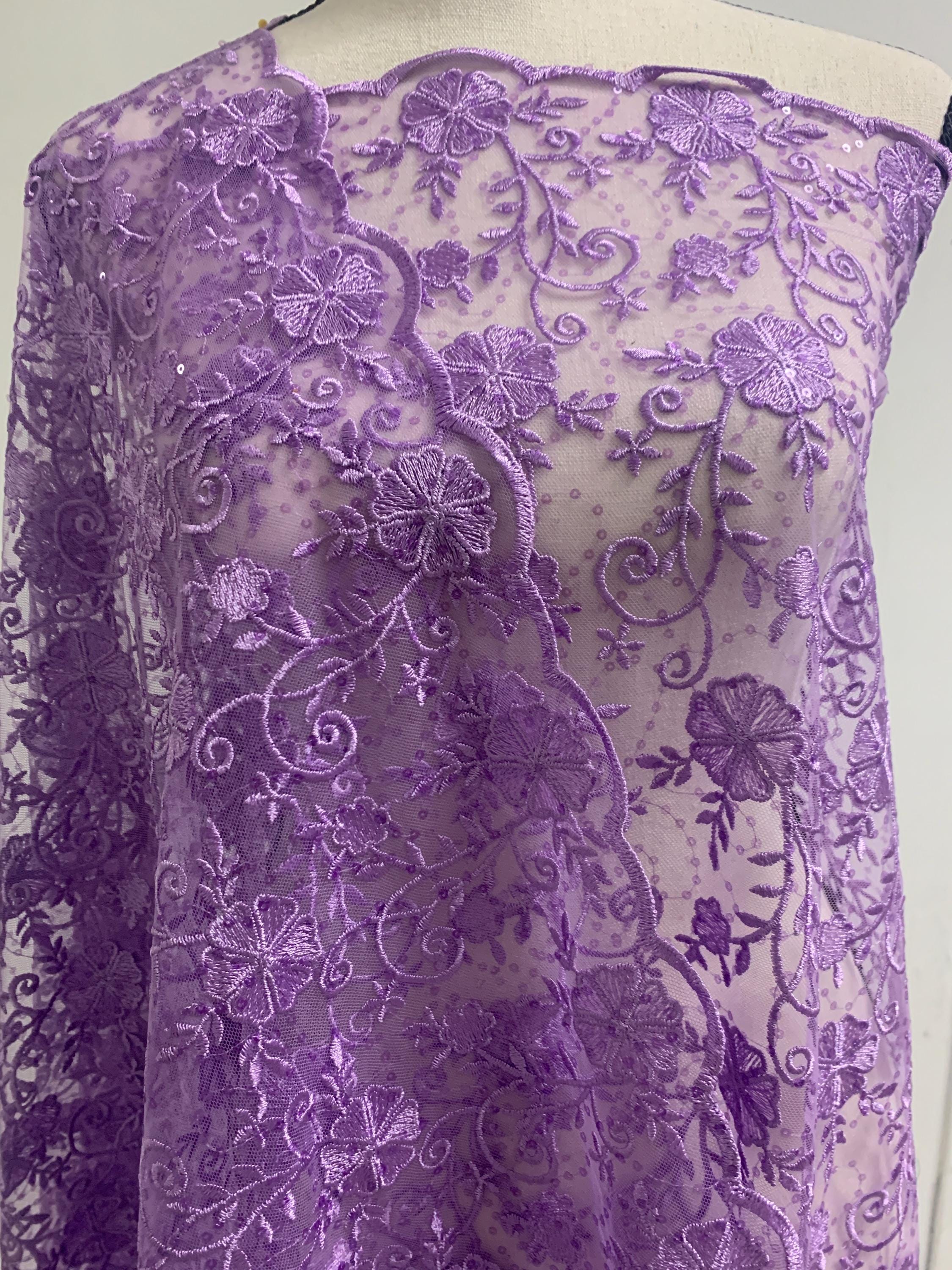 A 3-yard cut of Lilac Lace fabric with a width of 49/50 inches, featuring double scalloped embroidery and sequins. Design code: 04331279.