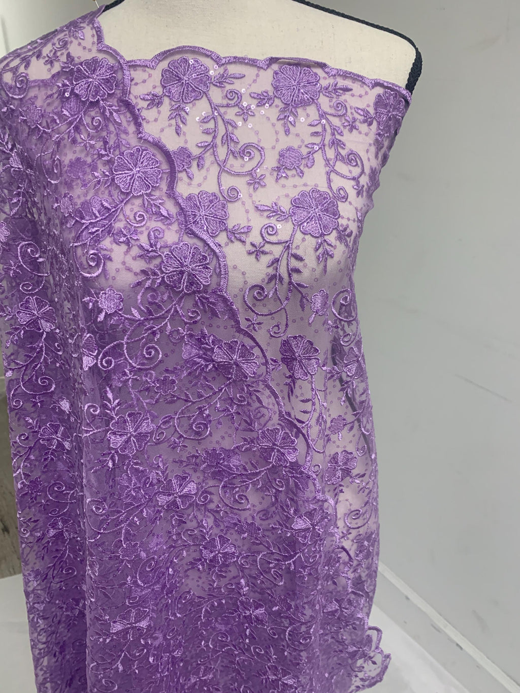 A 3-yard cut of Lilac Lace fabric with a width of 49/50 inches, featuring double scalloped embroidery and sequins. Design code: 04331279.