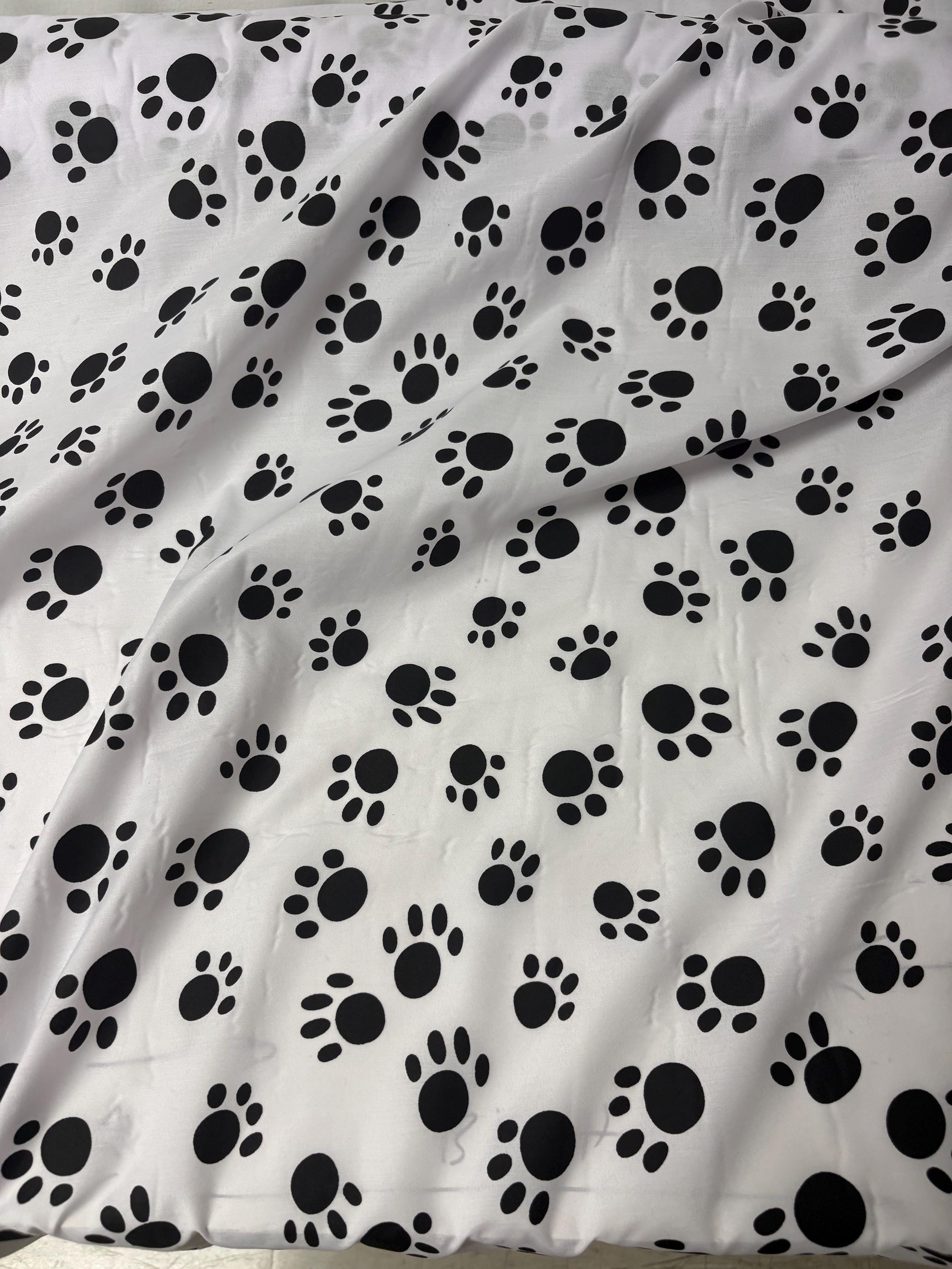 A 2 yard cut Paws print fabric, width 58/60" polyester fabric in black/W, shirt weight. kids crafts. sold by 2 yards and cut continuous.