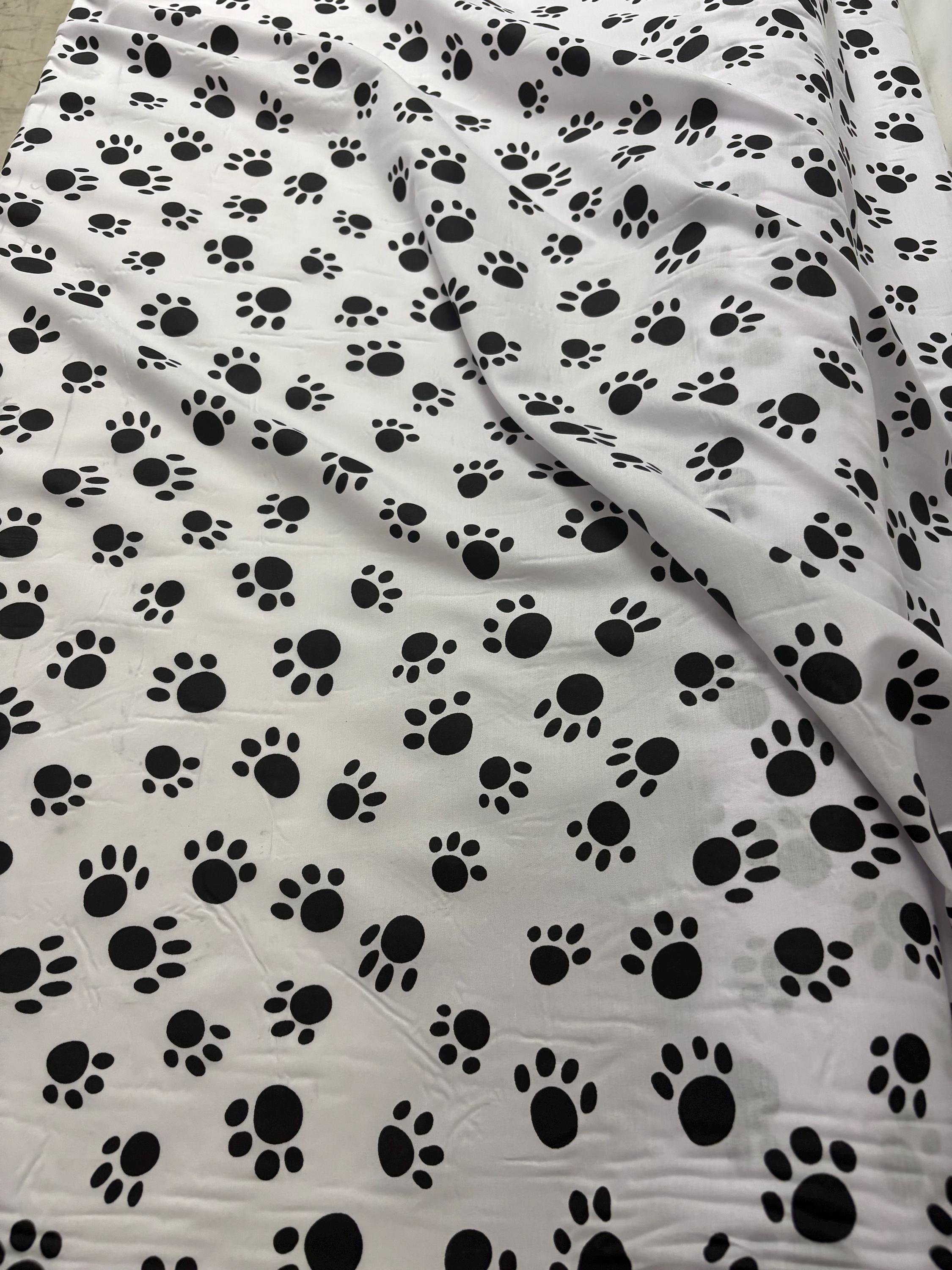 A 2 yard cut Paws print fabric, width 58/60" polyester fabric in black/W, shirt weight. kids crafts. sold by 2 yards and cut continuous.