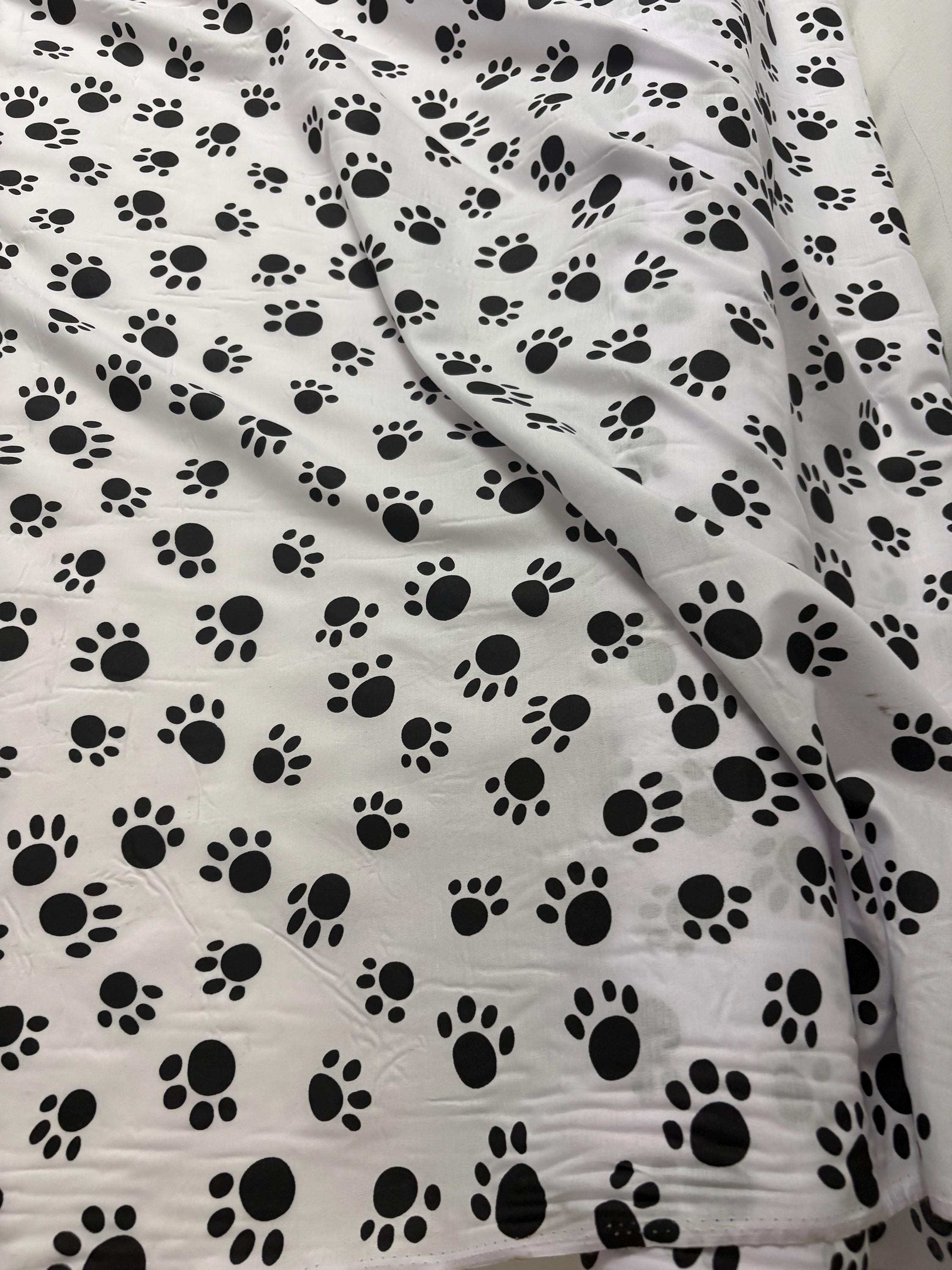A 2 yard cut Paws print fabric, width 58/60" polyester fabric in black/W, shirt weight. kids crafts. sold by 2 yards and cut continuous.