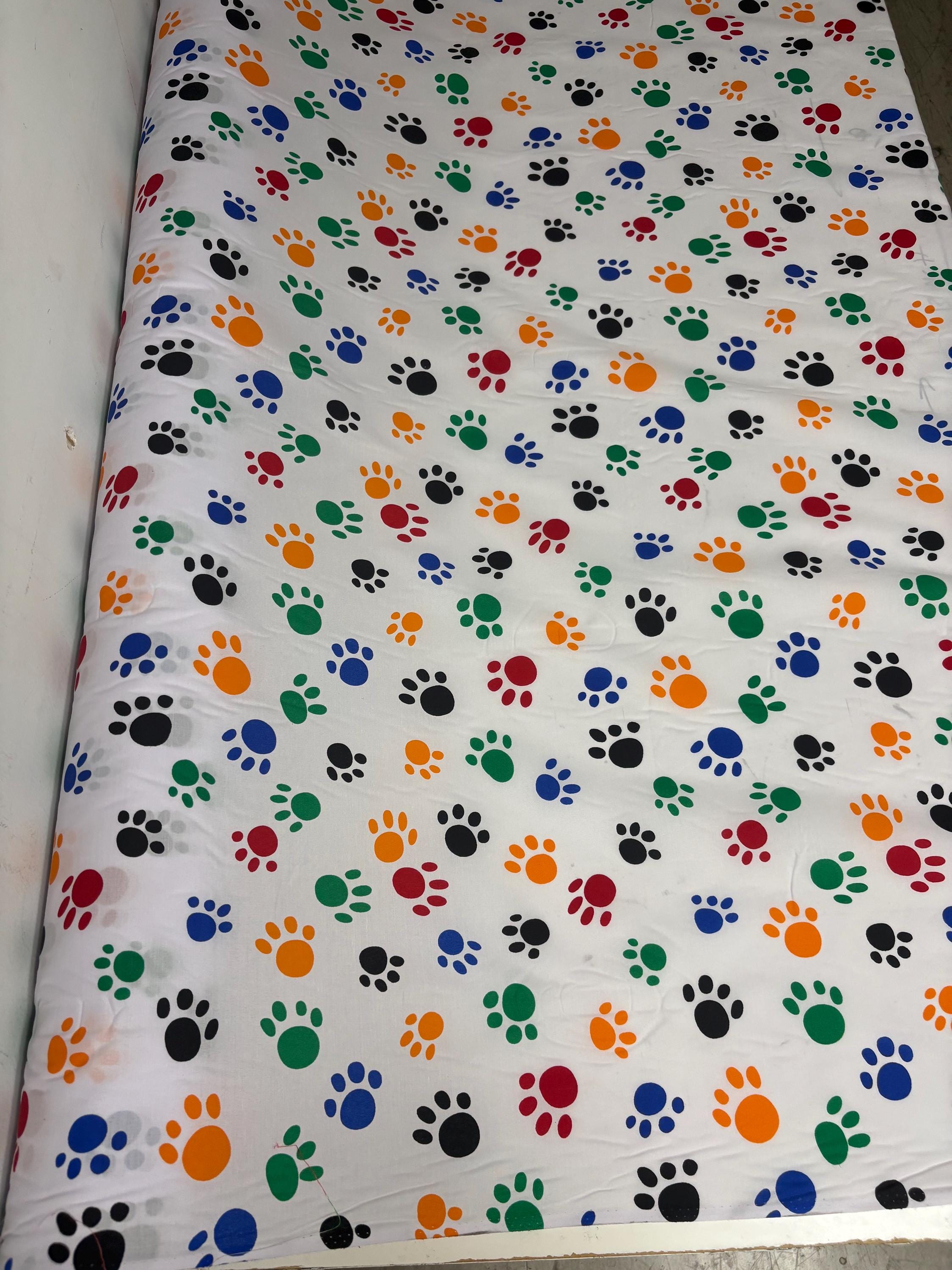 A 2 yard cut Paws print fabric, width 58/60" polyester fabric in Multi color, shirt weight. kids crafts. sold by 2 yards and cut continuous.