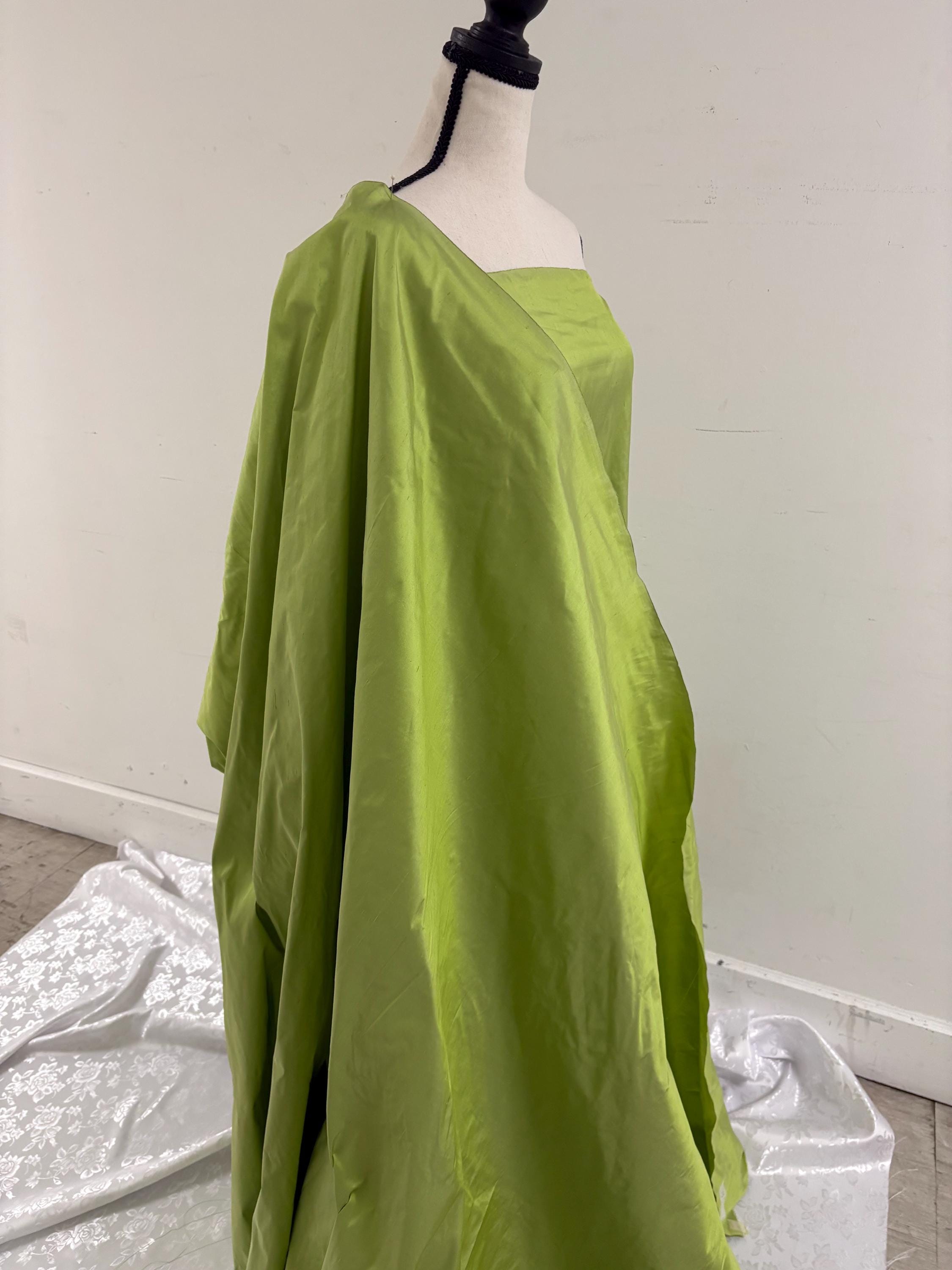 100% silk Dupioni Taffeta width 54" color lime sage. Machine made, fabric has slubbed. sell by 1 yard increment continuous. item # 1