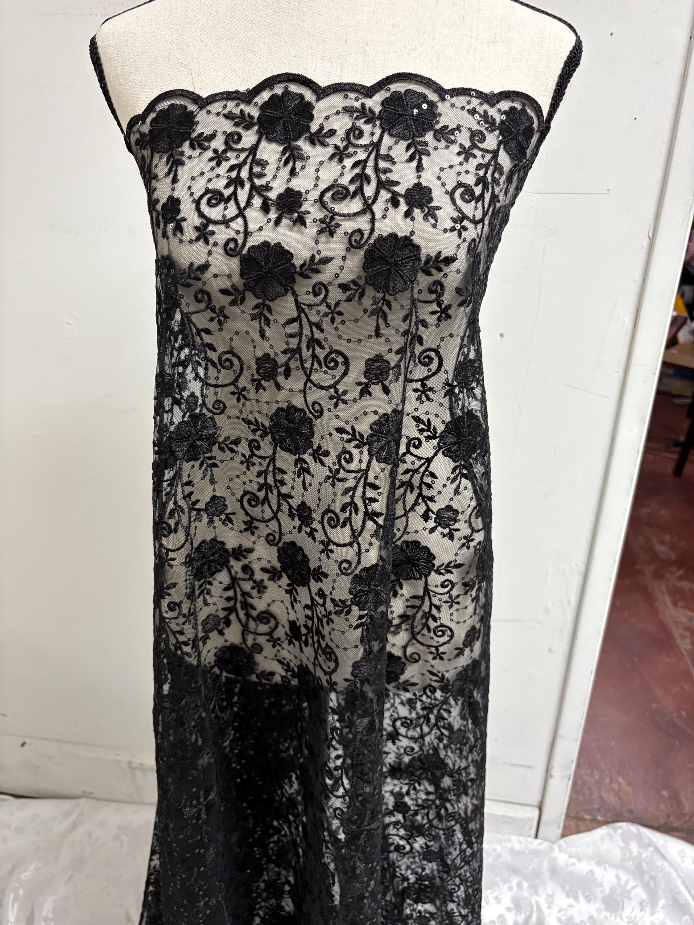 A 3-yard cut of Black Lace fabric with a width of 49/50 inches, featuring double scalloped embroidery and sequins. Design code: 04331279.