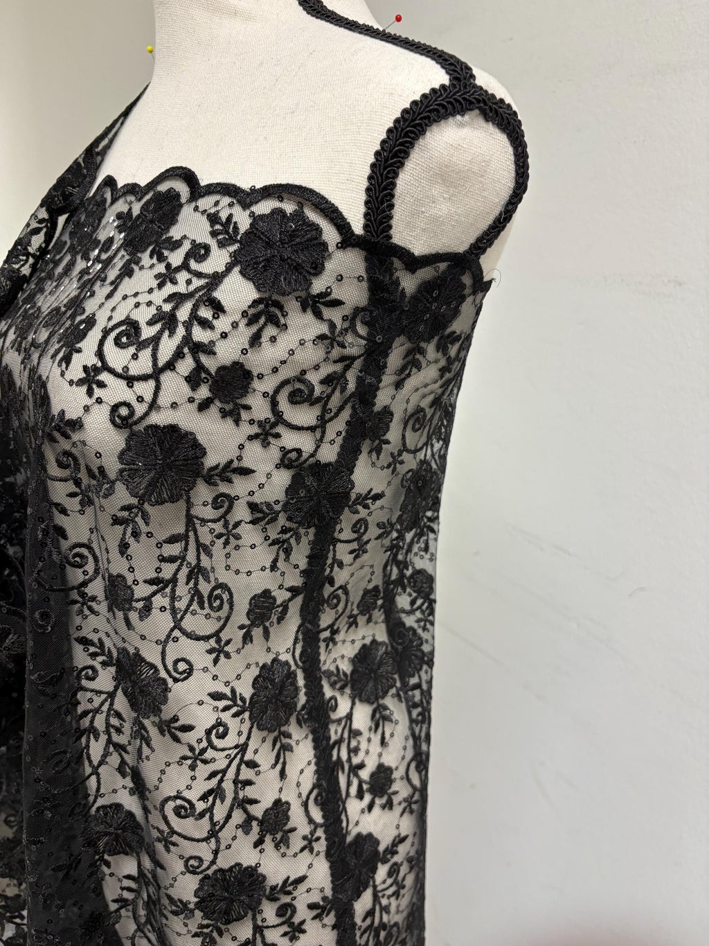 A 3-yard cut of Black Lace fabric with a width of 49/50 inches, featuring double scalloped embroidery and sequins. Design code: 04331279.