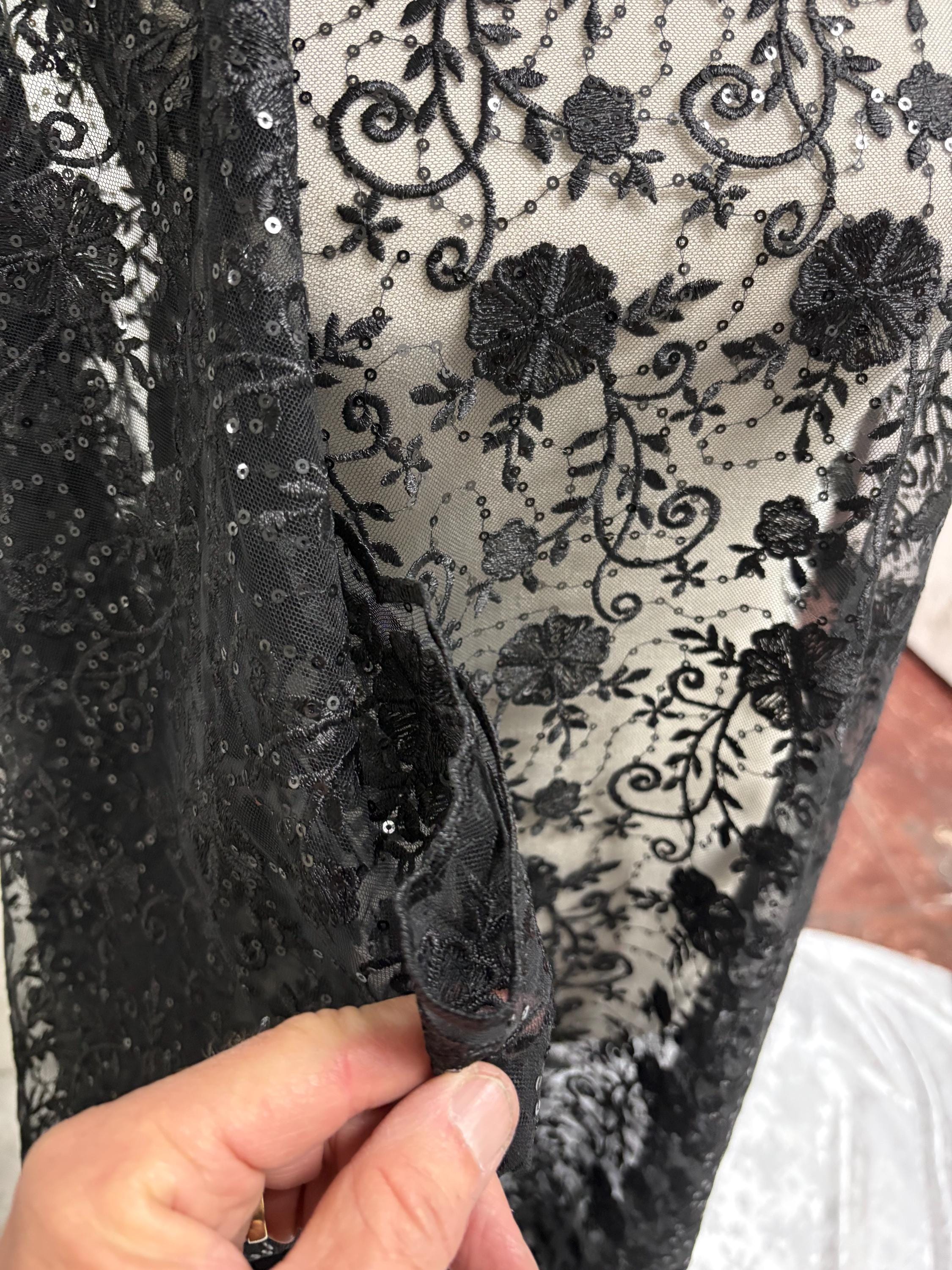A 3-yard cut of Black Lace fabric with a width of 49/50 inches, featuring double scalloped embroidery and sequins. Design code: 04331279.