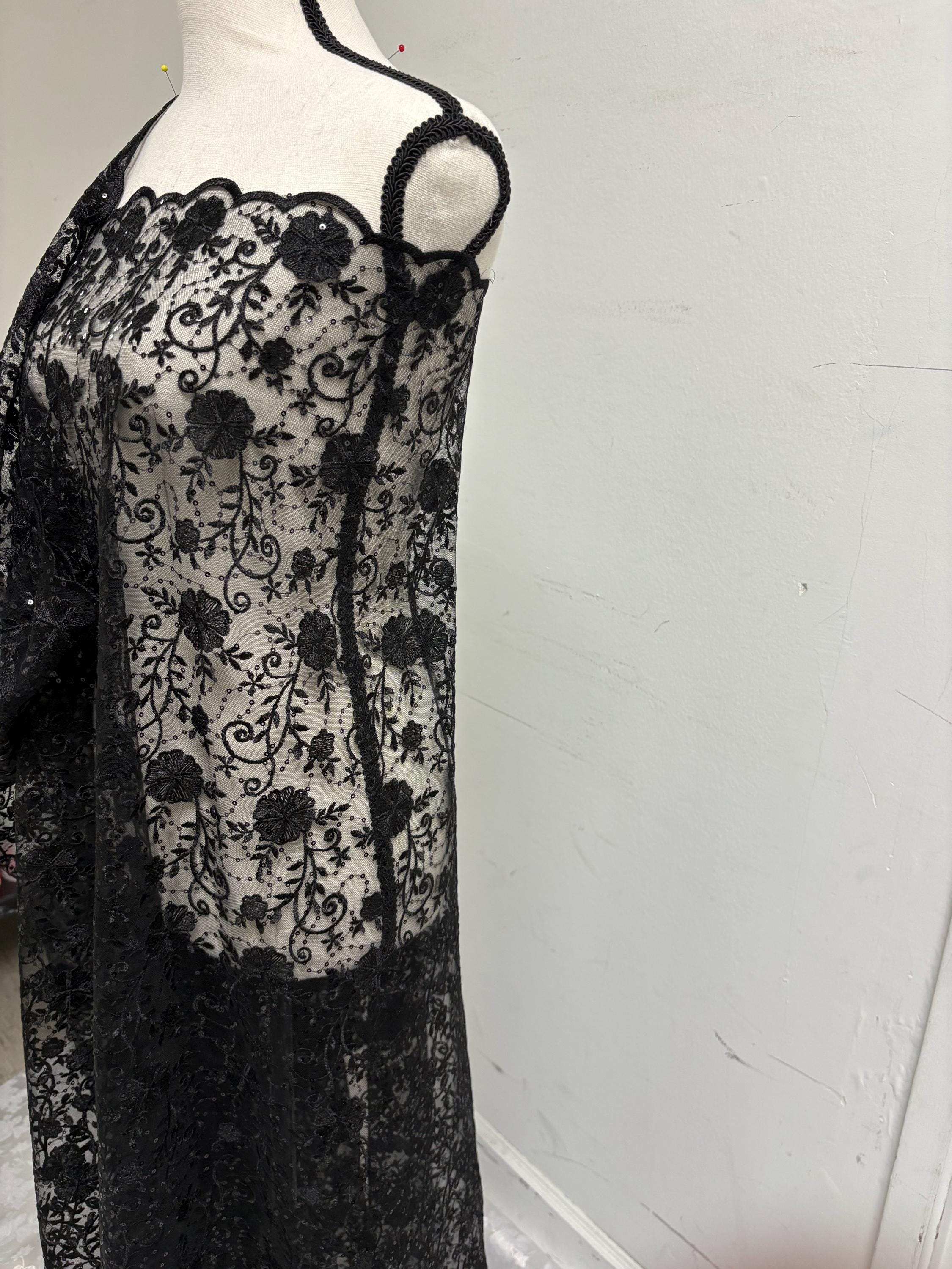 A 3-yard cut of Black Lace fabric with a width of 49/50 inches, featuring double scalloped embroidery and sequins. Design code: 04331279.