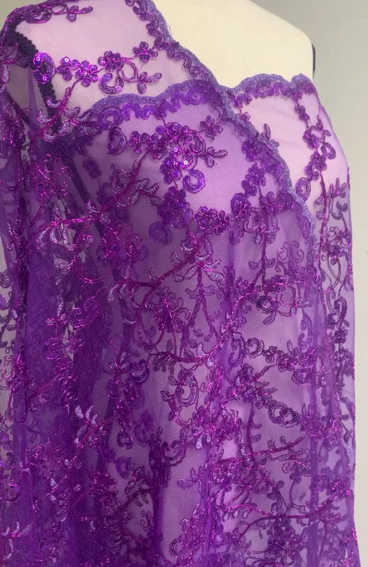A 3-yard cut of Lilac Lace fabric with a width of 49/50 inches, featuring double scalloped embroidery and sequins. Design code: 04331279.