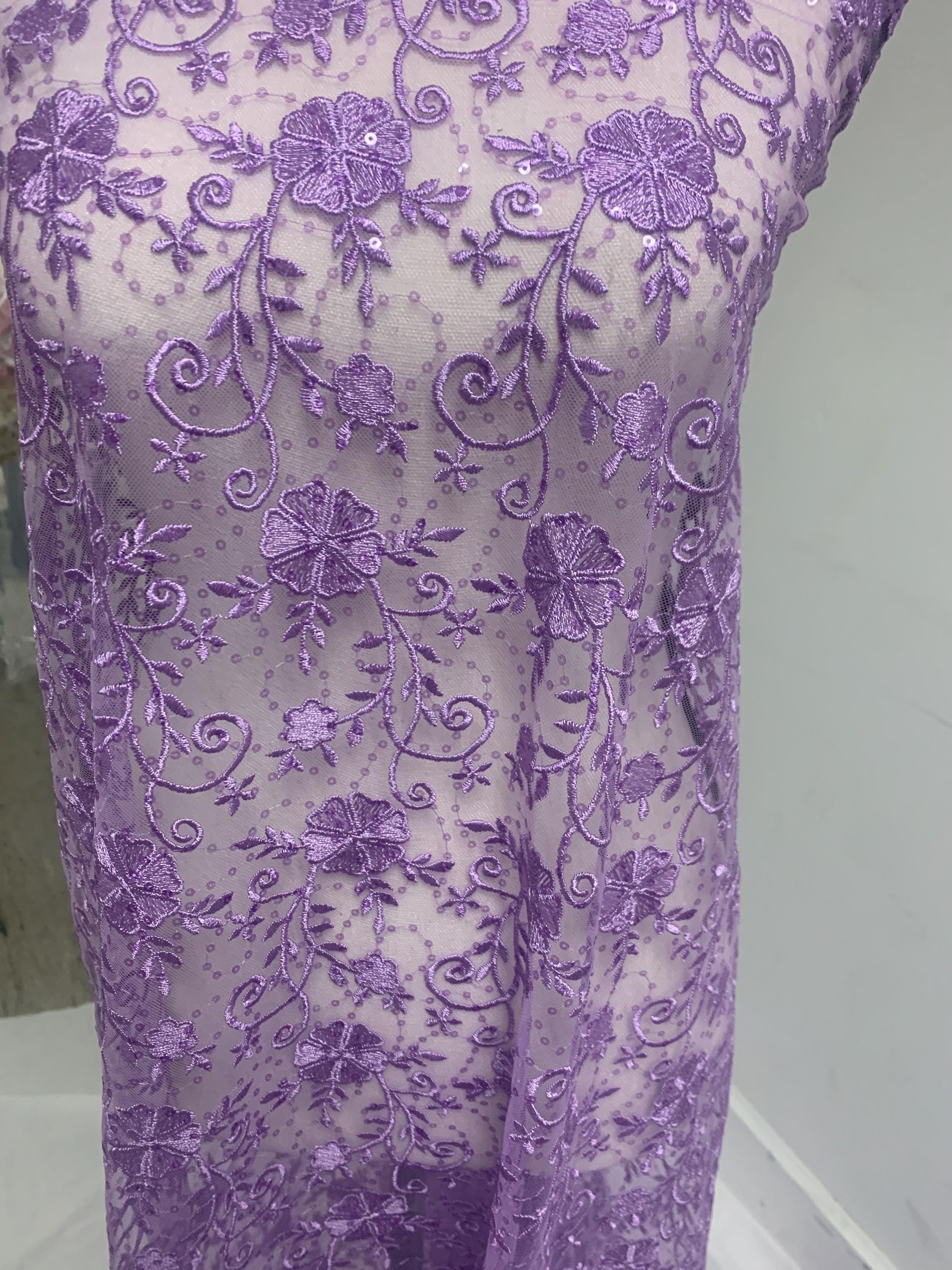 A 3-yard cut of Lilac Lace fabric with a width of 49/50 inches, featuring double scalloped embroidery and sequins. Design code: 04331279.
