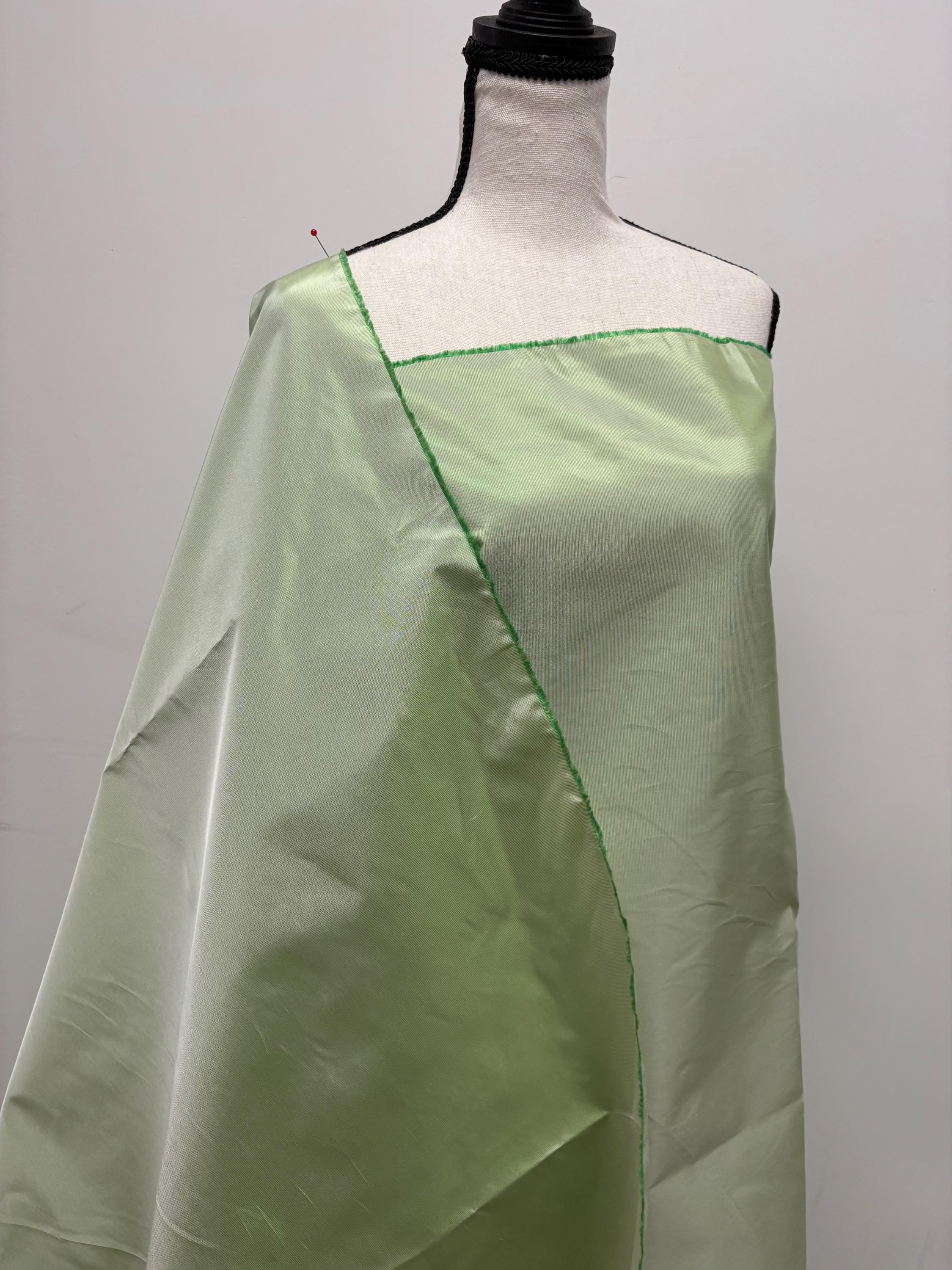 Lt. sage Taffeta fabric . Two tone fabric width 58" polyester fabric made two color green and white. item # 115