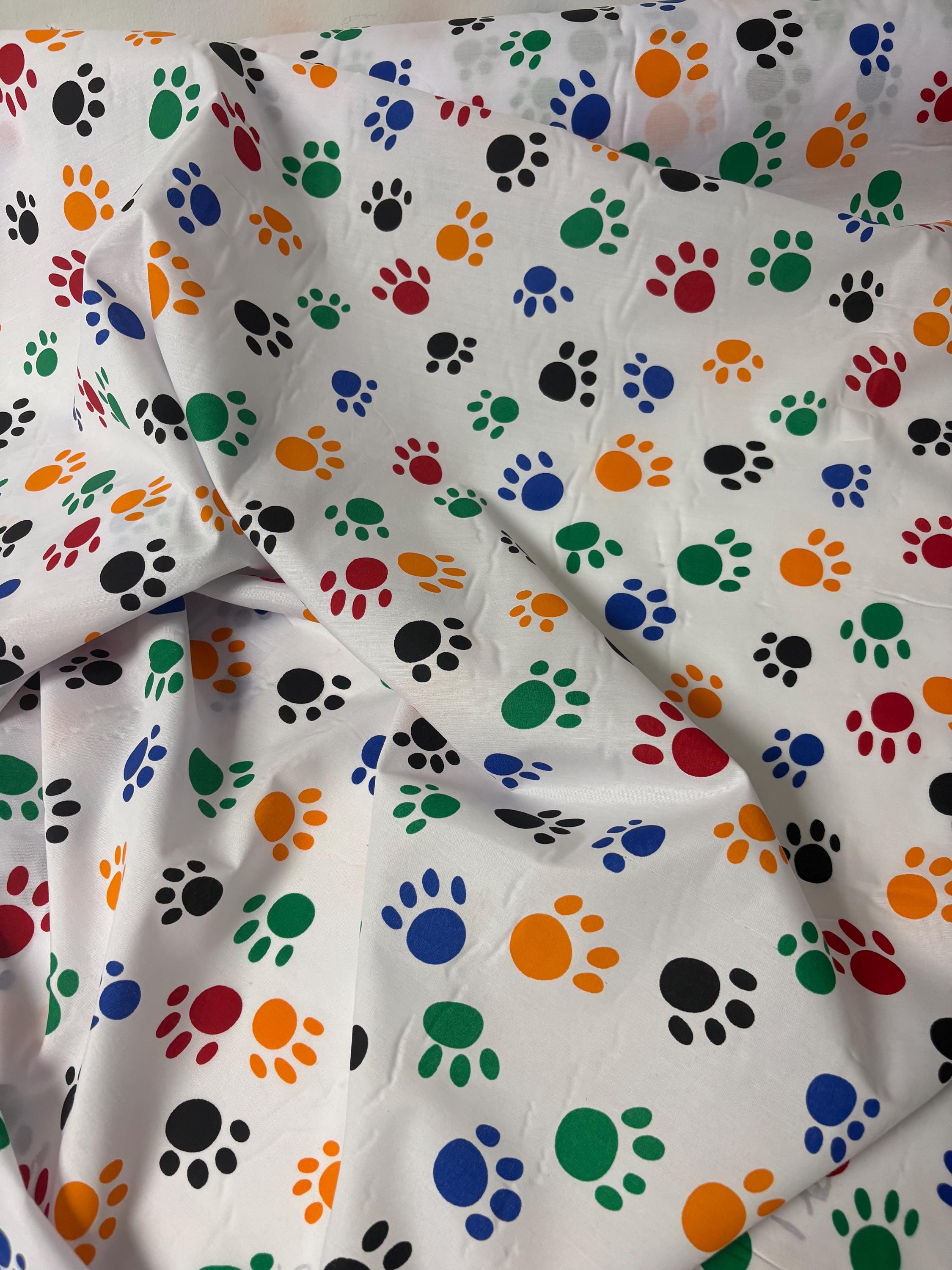 A 2 yard cut Paws print fabric, width 58/60" polyester fabric in Multi color, shirt weight. kids crafts. sold by 2 yards and cut continuous.
