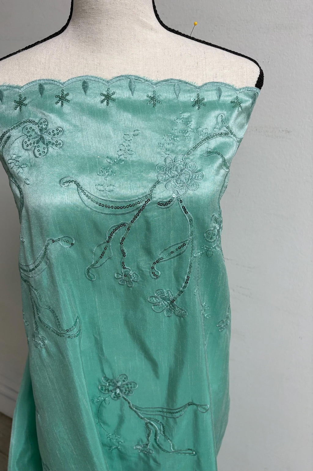 A 3 yards Tiffany satin Shantung Fabric width 58 inches polyester. Double scalloped sequins embroidery with slubbed texture.