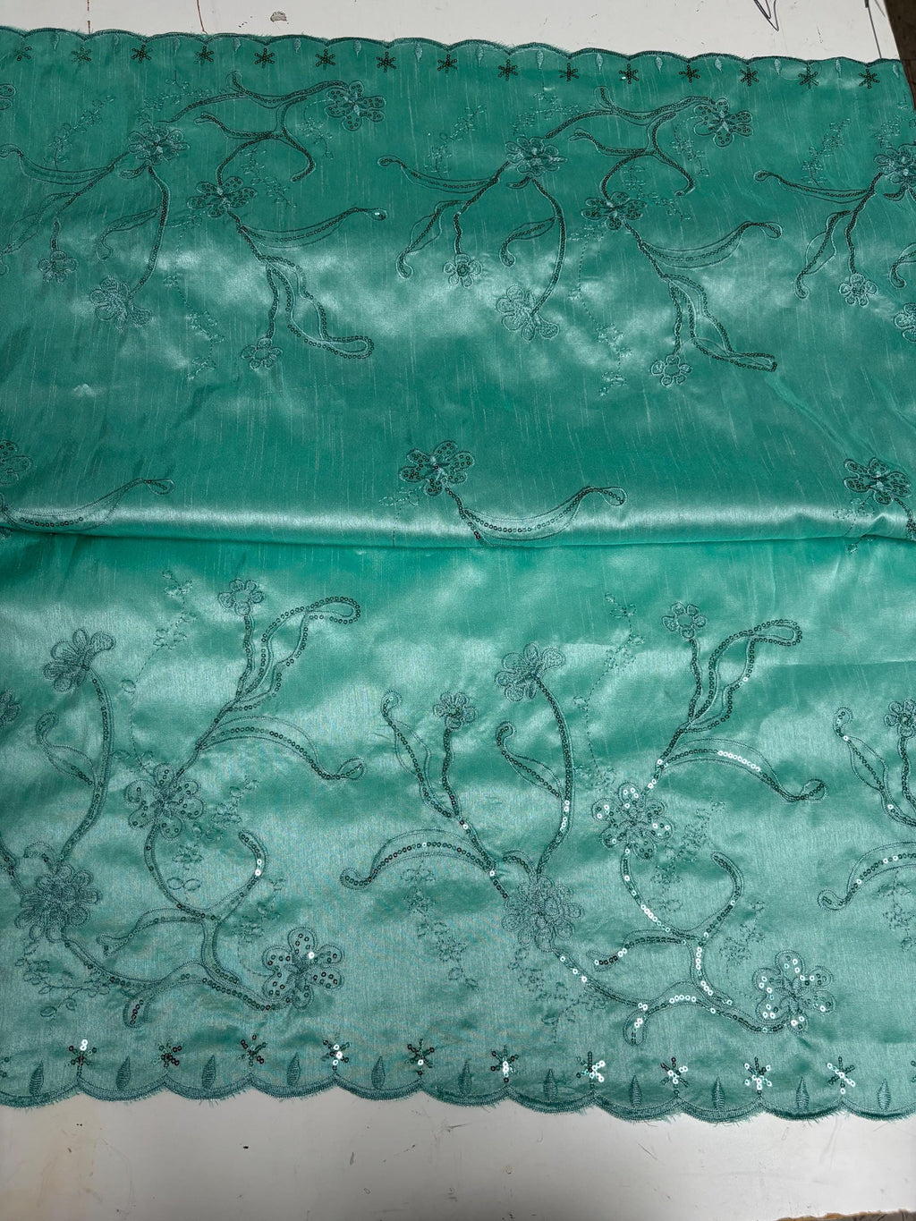 A 3 yards Tiffany satin Shantung Fabric width 58 inches polyester. Double scalloped sequins embroidery with slubbed texture.