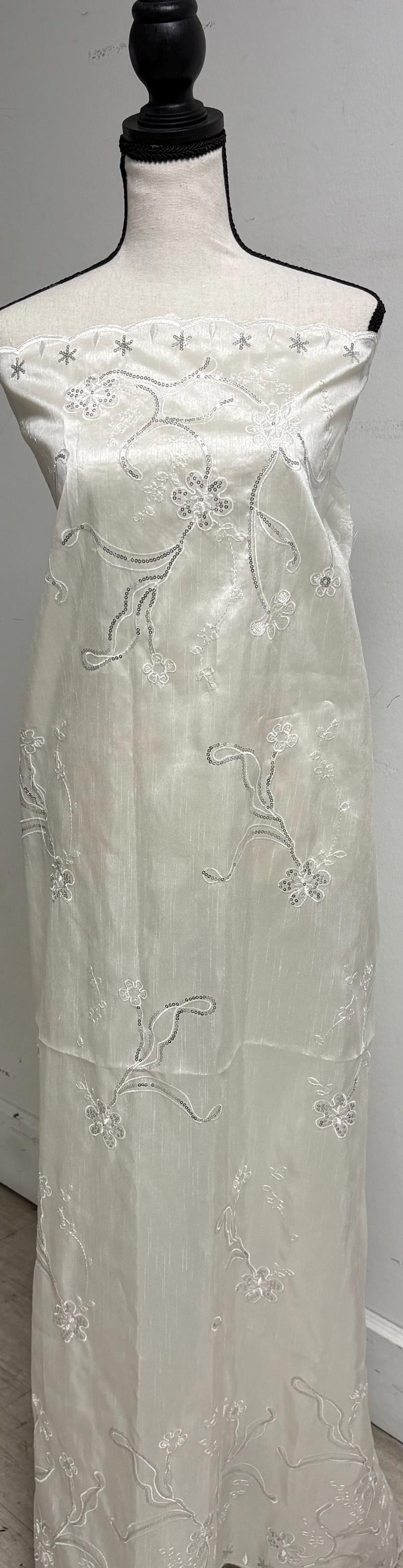 A 3 yards Ivory satin Shantung Fabric width 58 inches polyester. Double scalloped sequins embroidery with slubbed texture.