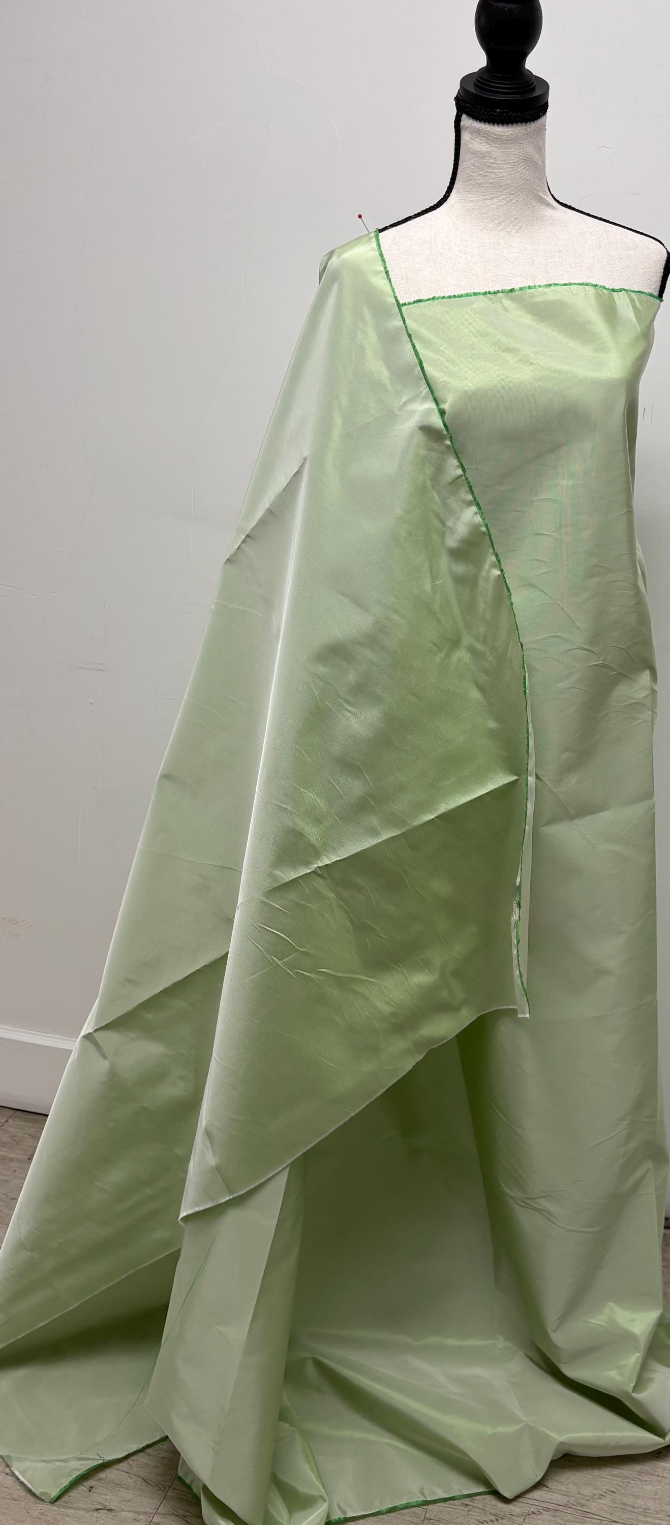 Lt. sage Taffeta fabric . Two tone fabric width 58" polyester fabric made two color green and white. item # 115