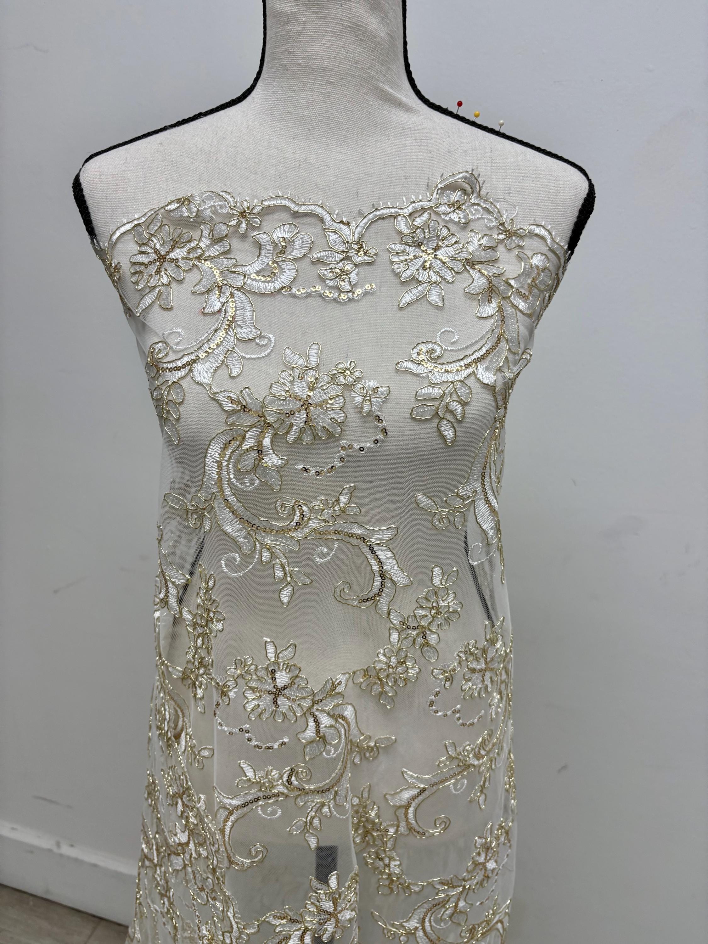 Ivory Gold lace fabric design yx846, sequins, embroidery double scalloped edges. Width 49/50".