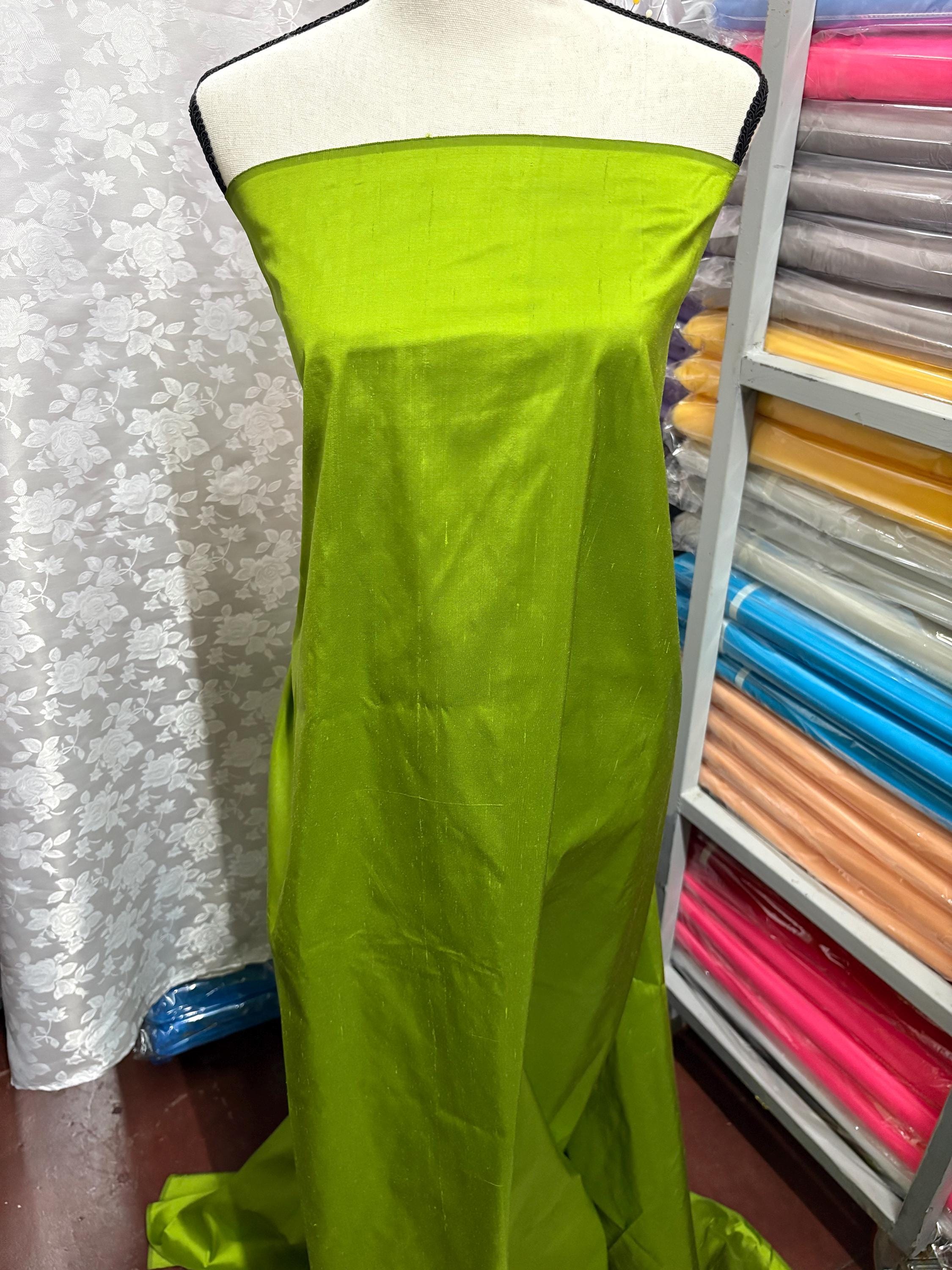 100% silk Dupioni Taffeta width 54" color is Lt.Olive. Machine made, fabric has slubs. Item # 4. free sample.