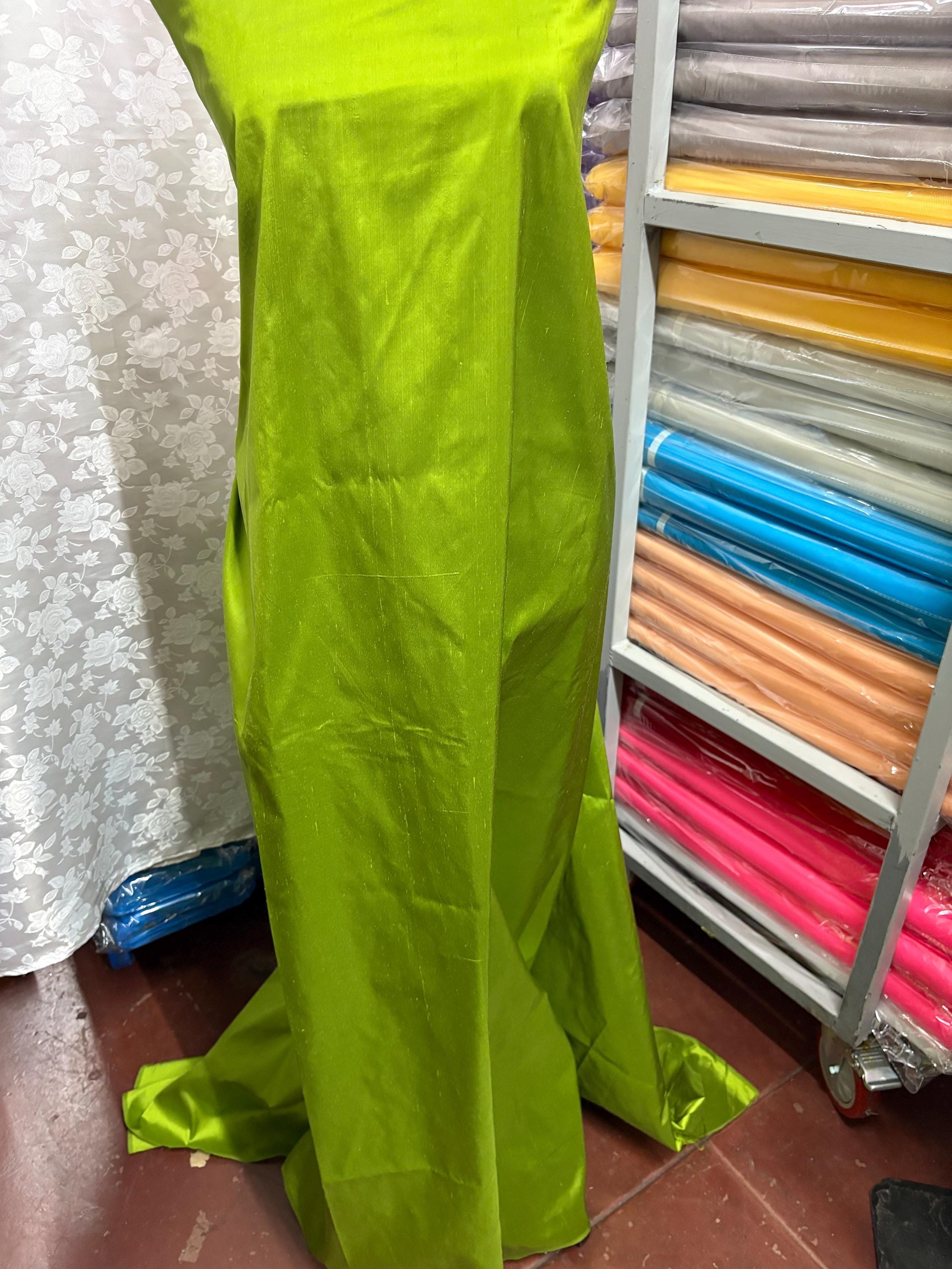 100% silk Dupioni Taffeta width 54" color is Lt.Olive. Machine made, fabric has slubs. Item # 4. free sample.